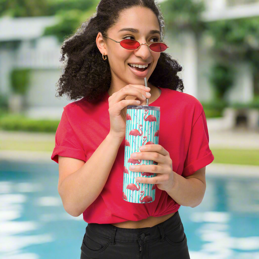 Tropical 20 oz flamingo tumbler with colorful artwork and insulated stainless steel body. Designed for summer fun, this reusable travel cup is great for poolside lounging, vacation road trips, or gifting. Flamingo print adds a fun, vibrant touch to any iced drink. Ideal for girls, moms, or flamingo fans looking for cute drinkware that’s functional and stylish.