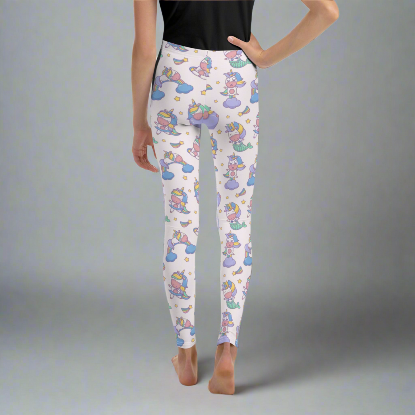 Image: Unicorn Mermaid Kawaii Girls Leggings. These pastel pink yoga pants feature a cute pattern graphic of Unicorn mermaids, stars and rainbows. The perfect birthday present, Christmas gift, school outfit for toddlers, tweens and teens, by jaecrece