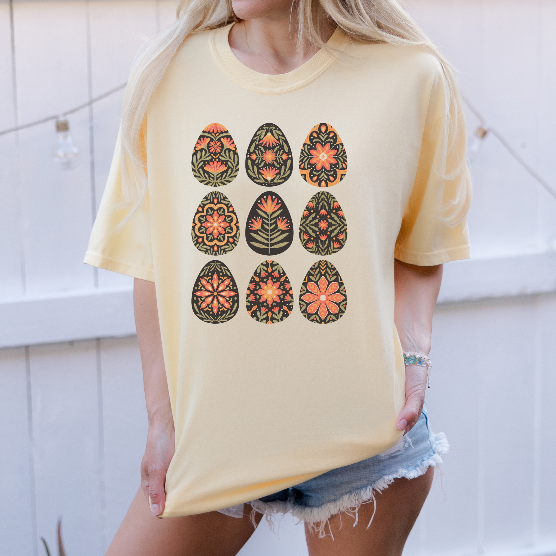 Image: This folk art Easter shirt features a vibrant floral and botanical Easter egg design with vintage Scandinavian influences. The intricate patterns reflect traditional Nordic craftsmanship, creating a timeless spring fashion statement. Perfect for casual outings or Easter festivities, this soft and stylish t-shirt brings together the beauty of cottagecore, boho aesthetics, and Swedish hygge in one charming piece, by jaecrece.