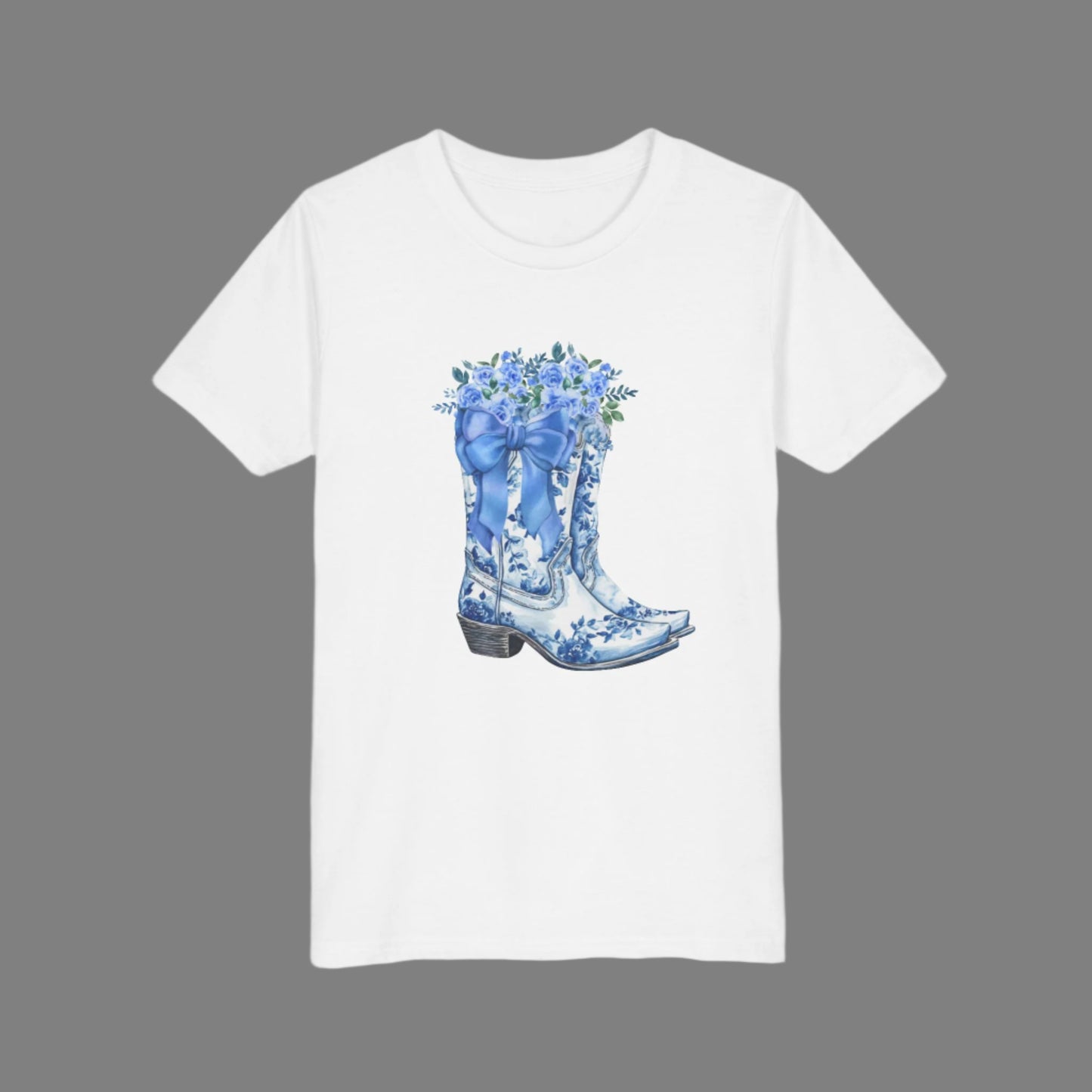 Image: This girls’ sweatshirt brings together western boots, soft florals, and a big blue bow in a toile-inspired design. Sized for kids S through XL, it’s a great choice for young fashionistas who love a mix of country charm and feminine detail. The soft cotton blend offers all-day comfort, making it perfect for school, weekend events, or cozy moments at home, by jaecrece.