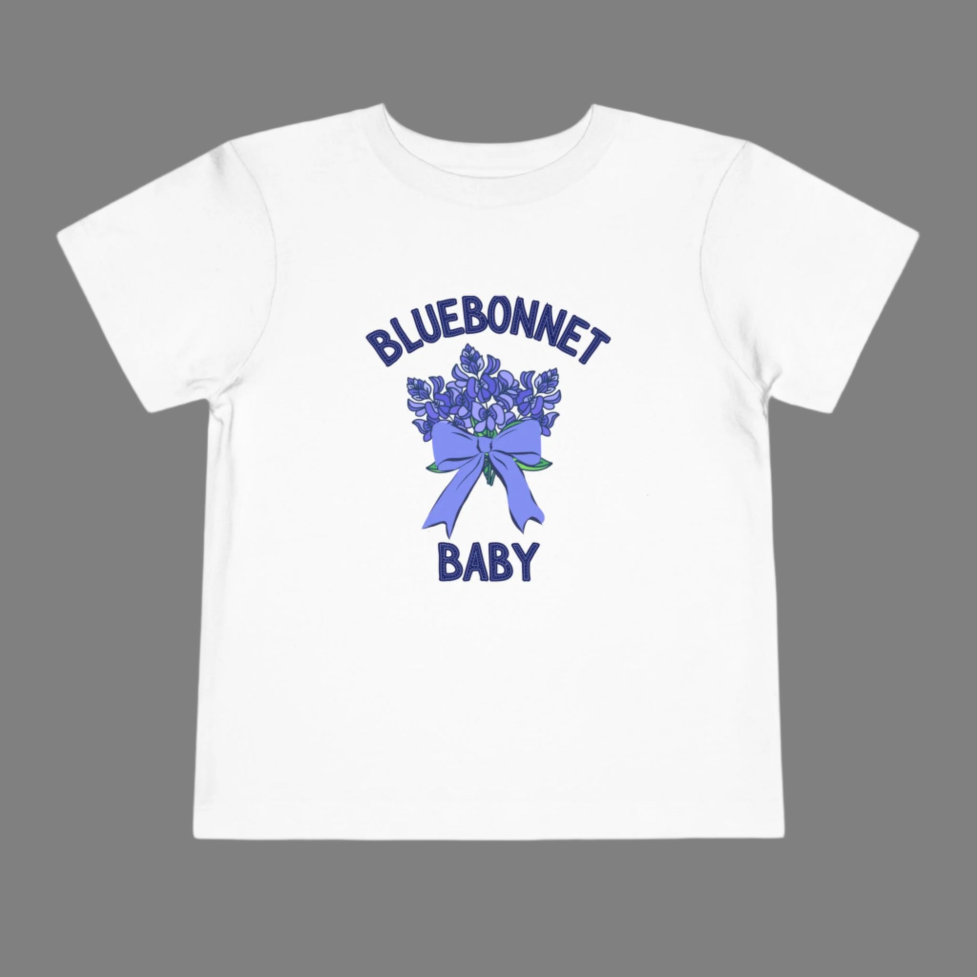 Image: This cute toddler t-shirt features a stunning bluebonnet design, making it a great outfit for spring adventures. The breathable cotton fabric ensures comfort for all-day wear at family gatherings, nature walks, or Easter celebrations. Designed with Texas pride in mind, it’s a must-have for parents who love their state’s wildflowers. A perfect baby shower gift or birthday present for Texas-born little ones, this tee is a springtime favorite, by jaecrece.