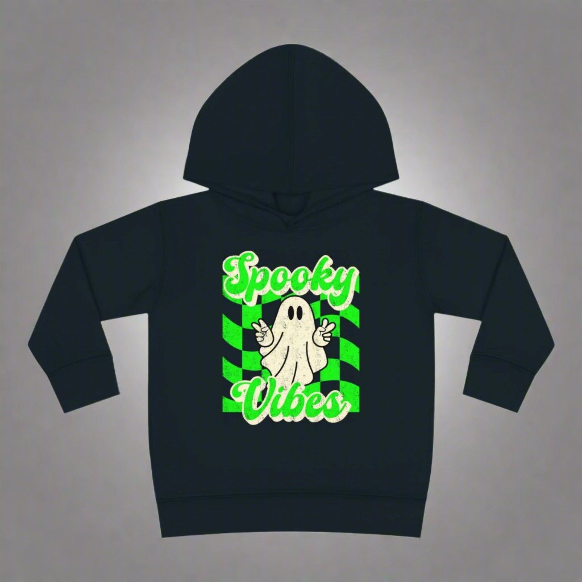 Spooky Vibes Halloween Toddler Hoodie. Featuring a green checkerboard design with a cute ghost giving peace signs, with the text spooky vibes. Mommy and Me/ Family Matching options, by jaecrece