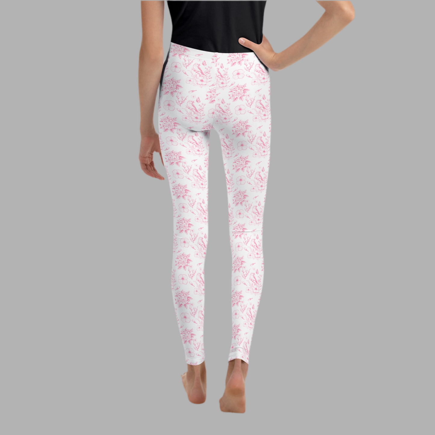 Image: Feminine youth leggings featuring a blush pink toile print, perfect for girls who love soft, vintage aesthetics. These stretchy pants are great for lounging, playdates, and dressing up with family. Offered in sizes 8 to 20, they’re also perfect for spring photos and everyday wear. Designed to match family sets for coordinated looks everyone will love, by jaecrece.