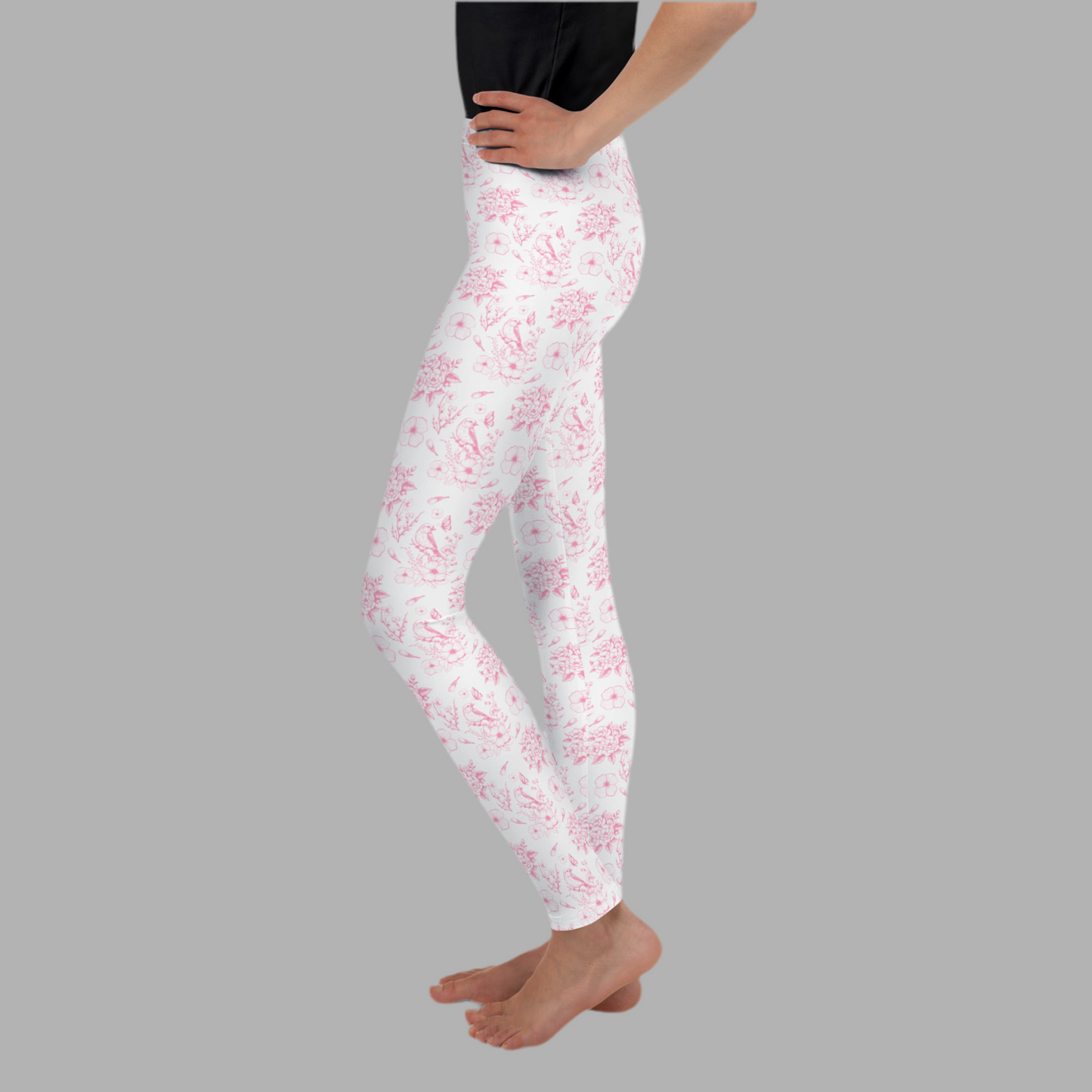 Image: Soft pink floral toile leggings made for tweens and teens who appreciate subtle vintage flair. These youth leggings blend comfort and style with a delicate French-inspired design, ideal for spring outings, holidays, or lounging at home. In sizes 8 to 20, they’re a great fit for girls who love aesthetic fashion. Perfect with sneakers or sandals for an effortlessly pretty look, by jaecrece.