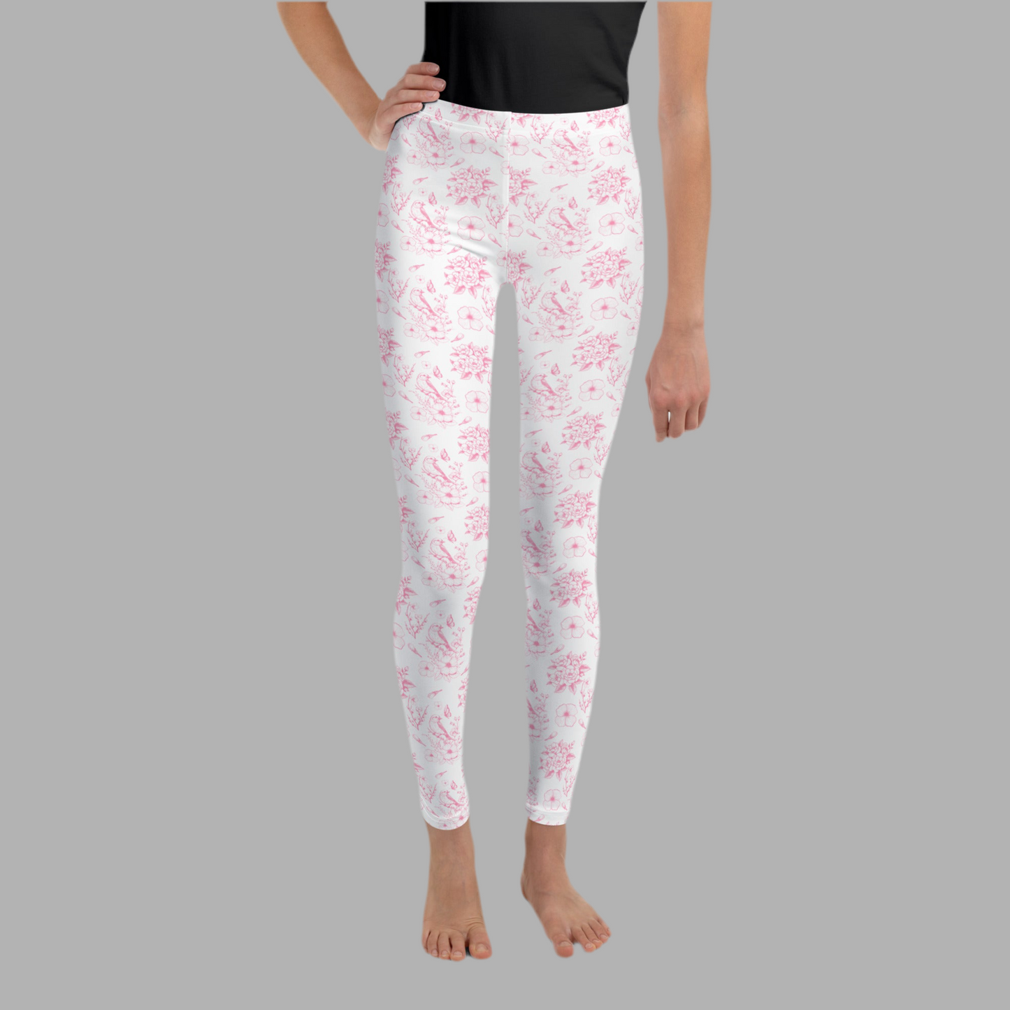 Image: Vintage-inspired toile leggings in blush pink for girls sizes 8 through 20. These youth leggings feature a timeless French countryside floral pattern perfect for tweens and teens who love romantic, soft fashion. Great for spring, back to school, or special events. Stylish and cozy, these leggings pair beautifully with oversized tees or cardigans, by jaecrece.