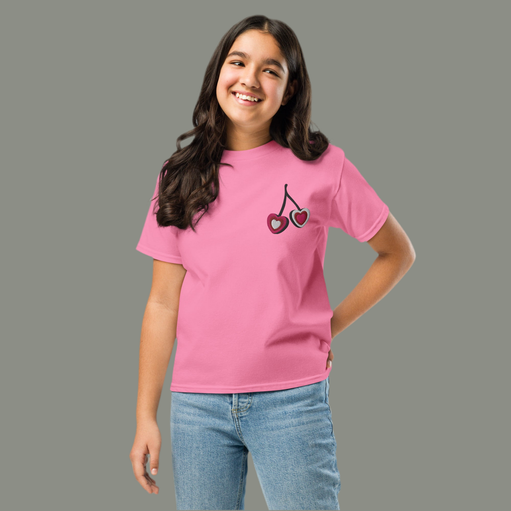 Image: Cherry Embroidery Shirt for Girls. This Valentines Day crewneck tee features two embroidered cherries on the left chest in red, pink and white with black stems. Great gift for tweens and toddlers who love the cherrycore aesthetic, by jaecrece