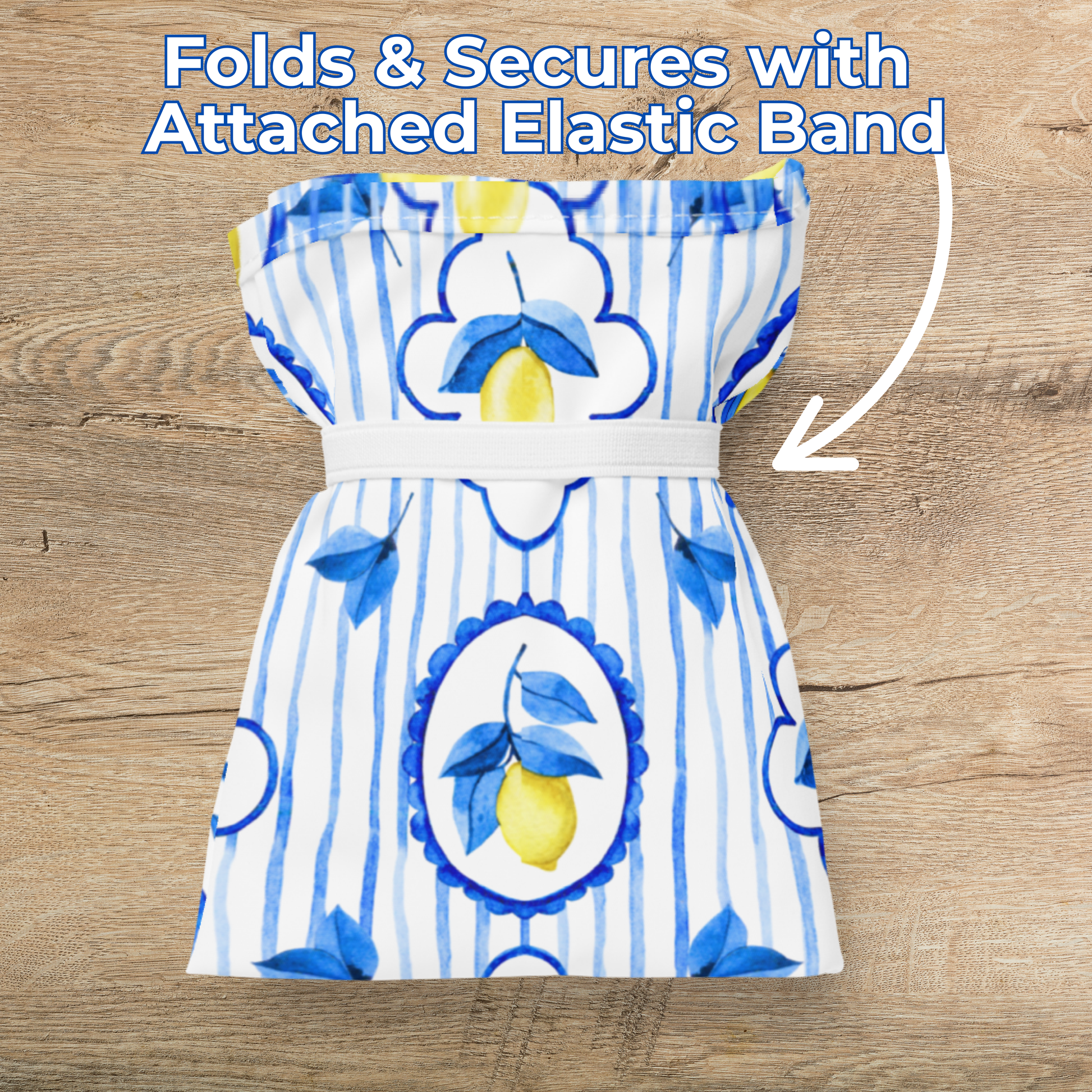 Amalfi Lemon Tote Bag with reusable eco friendly design inspired by Mediterranean summers, featuring watercolor lemons and chic blue tile details. Durable fabric and straps built directly into the bag mean it won’t rip, even when carrying heavy groceries or beach gear. Tote measures 15.5" × 25.3" and folds up with an elastic band to keep in your purse or car. A fun Italian summer gift idea or market day essential.