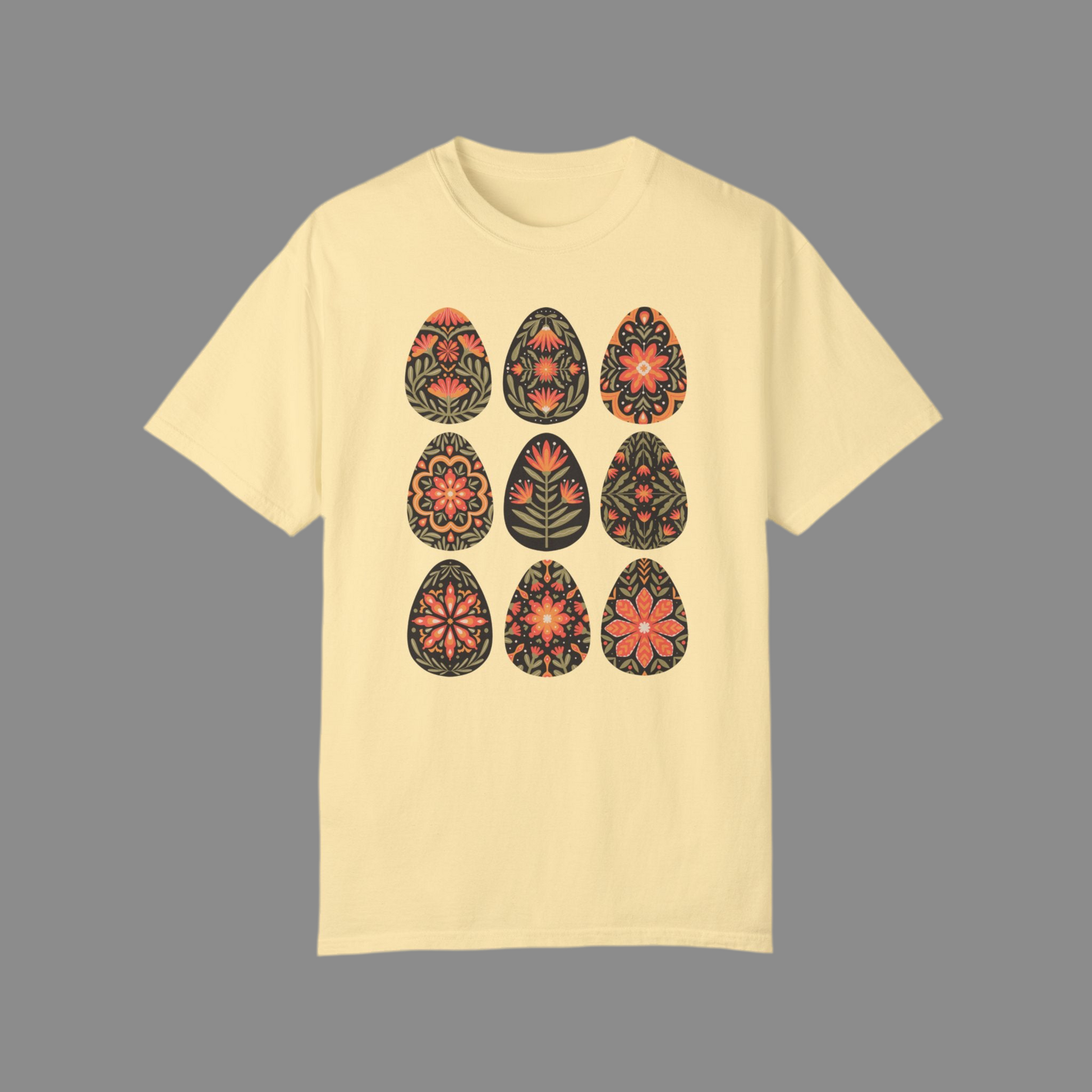 Image: This folk art Easter shirt features a vibrant floral and botanical Easter egg design with vintage Scandinavian influences. The intricate patterns reflect traditional Nordic craftsmanship, creating a timeless spring fashion statement. Perfect for casual outings or Easter festivities, this soft and stylish t-shirt brings together the beauty of cottagecore, boho aesthetics, and Swedish hygge in one charming piece, by jaecrece.