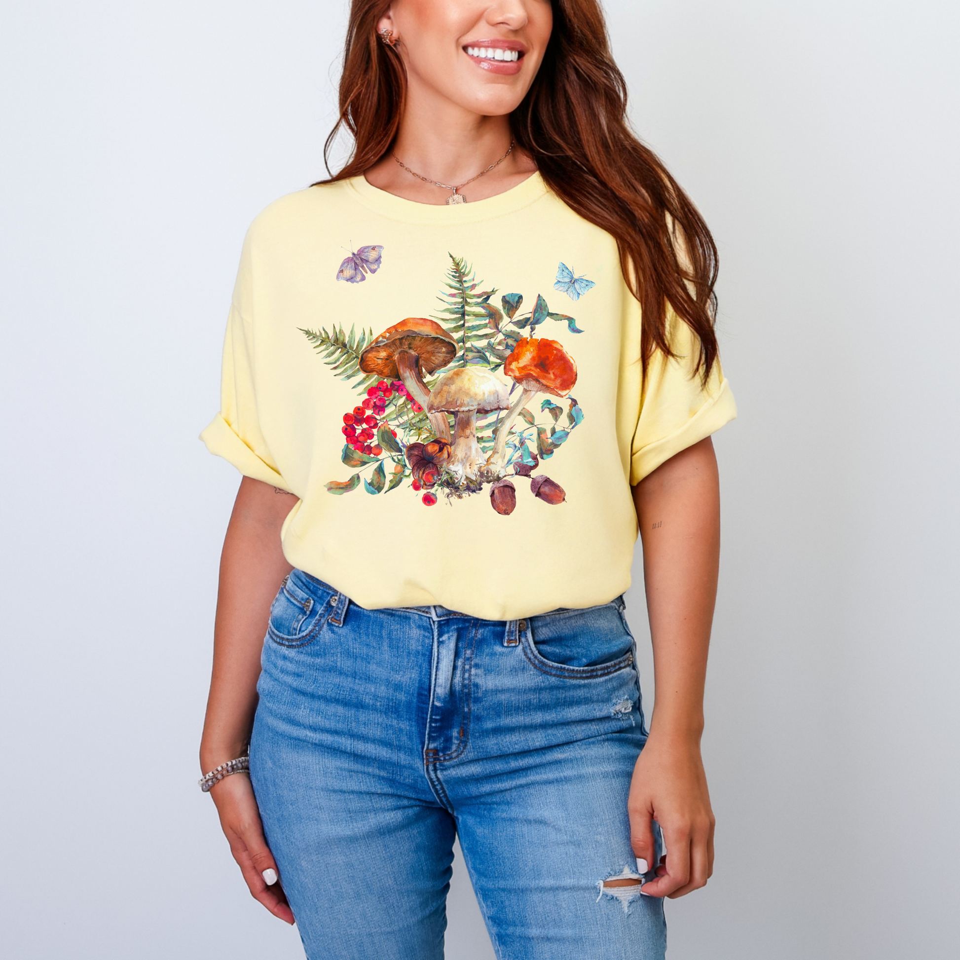 Comfort Colors 1717 Boho Mushroom Shirt with a magical garden-inspired print of mushrooms, ferns, butterflies, moths, and acorns. This unisex woodland graphic tee in earthy tones Ivory, Blue Spruce, Butter, Granite, and Pepper fits perfectly into goblincore, gardencore, fairyboho, and boho mystic fashion trends. Ideal for fall and autumn outfits, layered looks, or cozy casual wear. A made-to-order nature graphic shirt that doubles as a thoughtful gift for mushroom lovers, forest enthusiasts, plant lovers, a