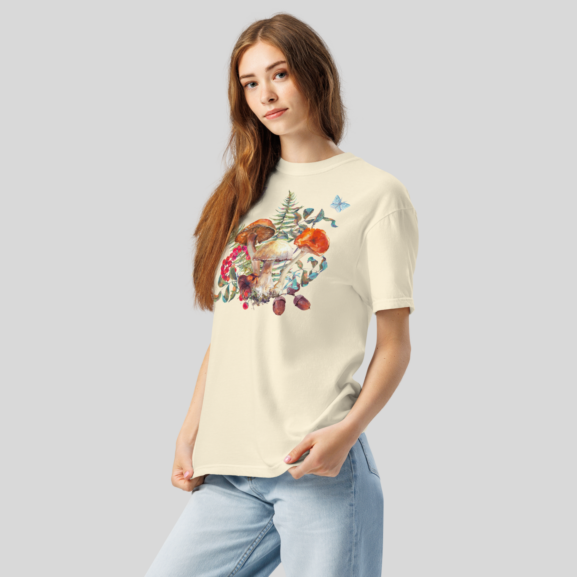 Boho Mushroom Shirt printed on Comfort Colors 1717 fabric, featuring garden-inspired mushrooms, ferns, butterflies, moths, and berries. Available in earthy tones Ivory, Blue Spruce, Butter, Granite, and Pepper, this unisex woodland shirt fits perfectly into cottagecore, goblincore, fairyboho, and boho mystic fashion. Relaxed and soft, perfect for fall layering, casual autumn outfits, or cozy wardrobe styling.