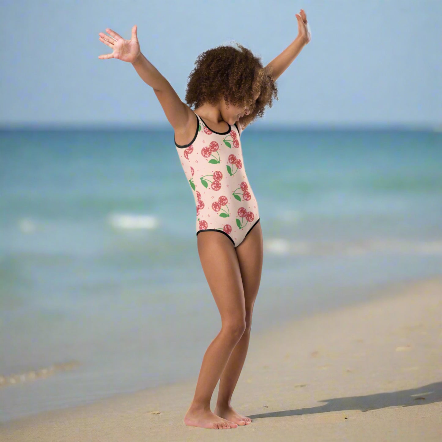Image: Disco Cherries Kids One Piece Swimsuit n sizes 2T-7, This fruit inspired swimsuit is a part of our Family Matching Swimwear Collection, and features a pink background with red disco ball cherries and stars, by jaecrece