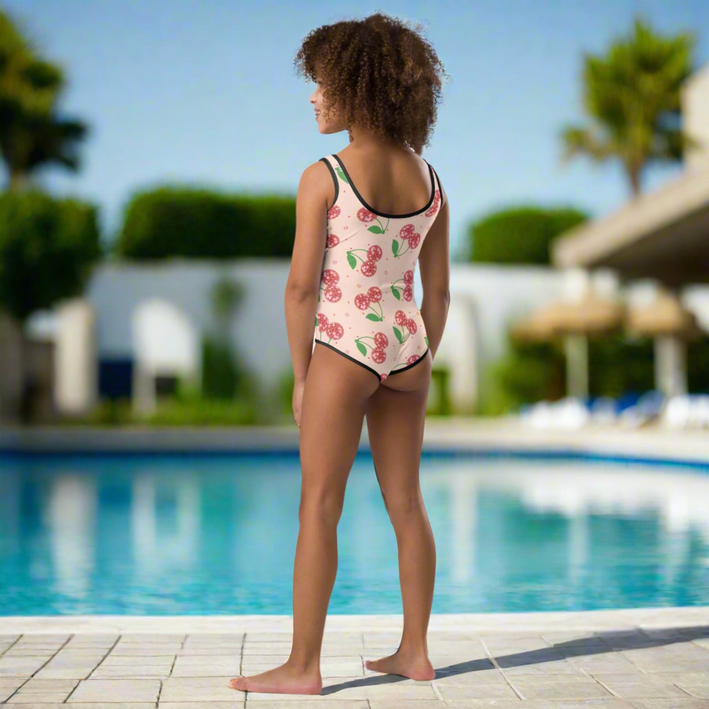 Image: Disco Cherries Kids One Piece Swimsuit n sizes 2T-7, This fruit inspired swimsuit is a part of our Family Matching Swimwear Collection, and features a pink background with red disco ball cherries and stars, by jaecrece