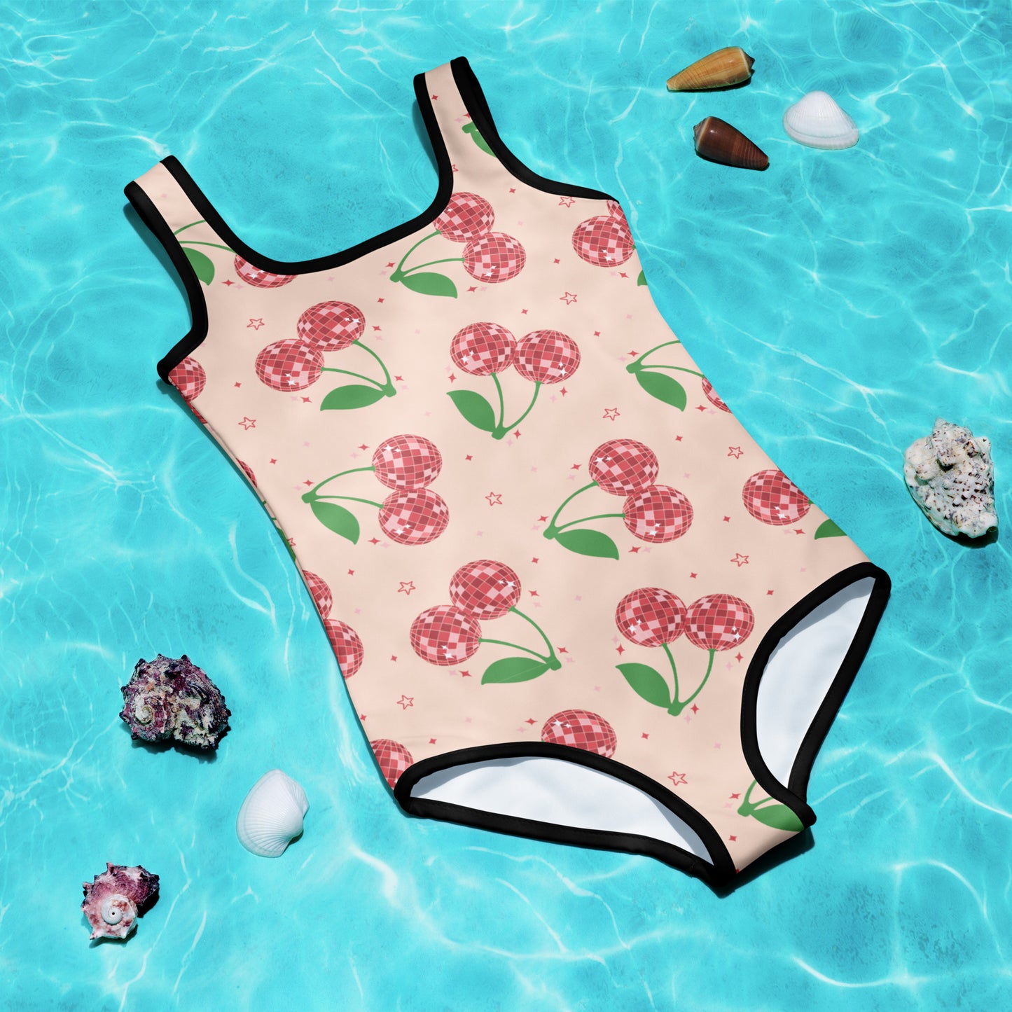 Cute and colorful girls’ one-piece swimsuit with pink background and red disco ball cherry pattern, available in toddler sizes 2T–7. Perfect for beach vacations, pool parties, and summer fun, this kids swimsuit is part of a matching family swim collection, also available in adult sizes. Made with double-layered front, UPF 38–40 sun protection, and stretchy, durable fabric for all-day comfort.