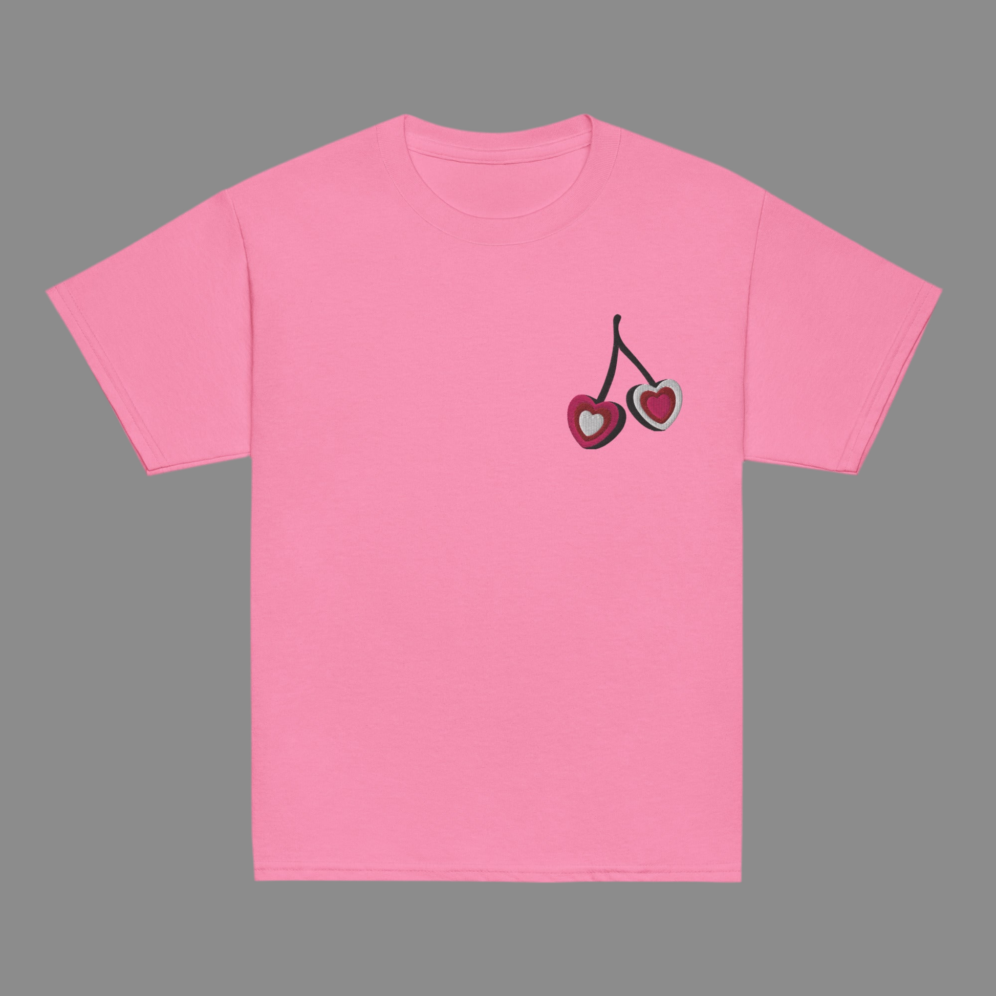 Image: Cherry Embroidery Shirt for Girls. This Valentines Day crewneck tee features two embroidered cherries on the left chest in red, pink and white with black stems. Great gift for tweens and toddlers who love the cherrycore aesthetic, by jaecrece