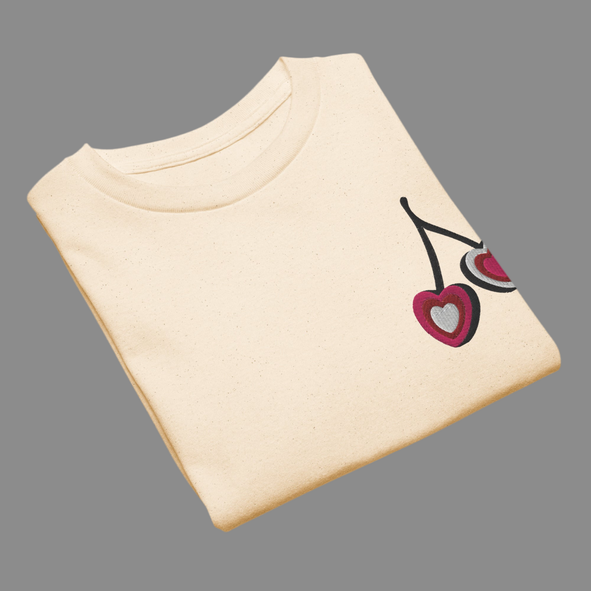 Image: Cherry Embroidery Shirt for Girls. This Valentines Day crewneck tee features two embroidered cherries on the left chest in red, pink and white with black stems. Great gift for tweens and toddlers who love the cherrycore aesthetic, by jaecrece