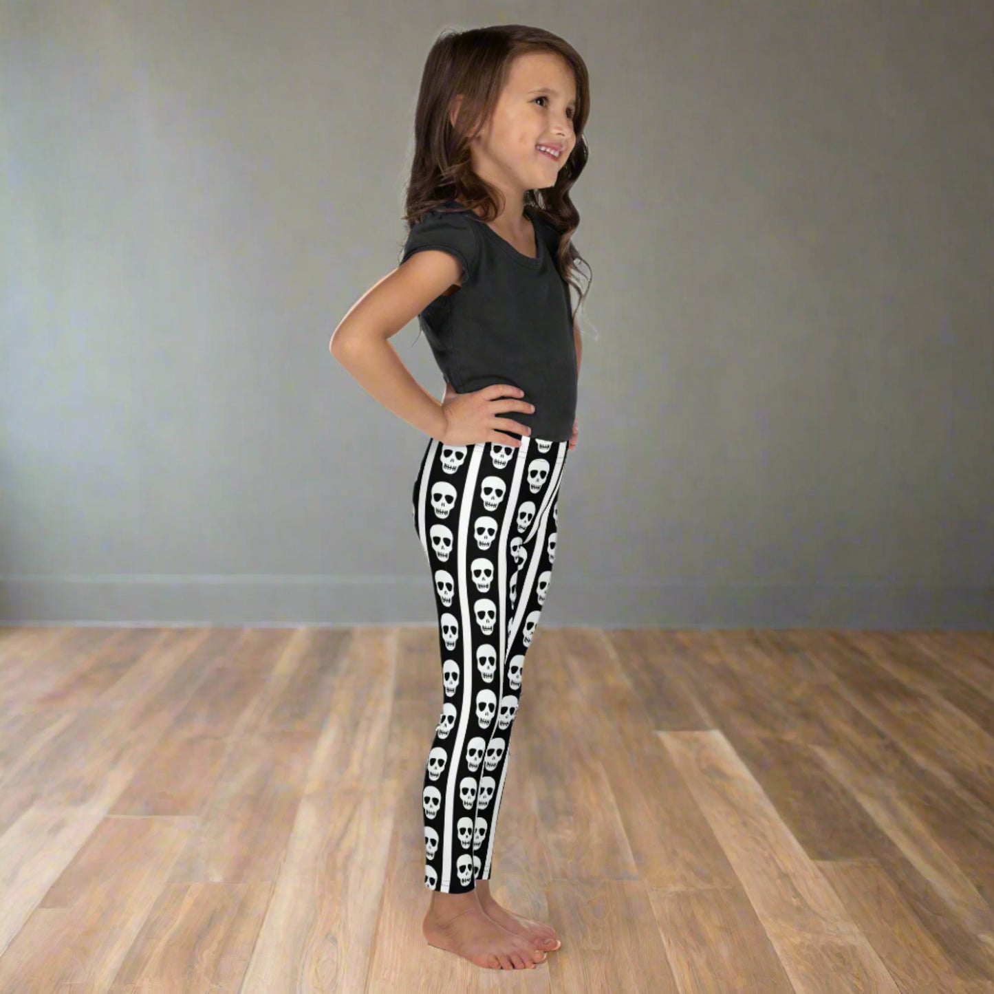 Image: These toddler and children’s leggings feature alternating black and white stripes with a trail of skulls down each leg, perfect for little ones who love Halloween or cool designs. Crafted for movement and comfort, they’re great for school events, themed birthdays, or everyday wear with a little extra attitude. Available in sizes for toddlers and young kids, by jaecrece.