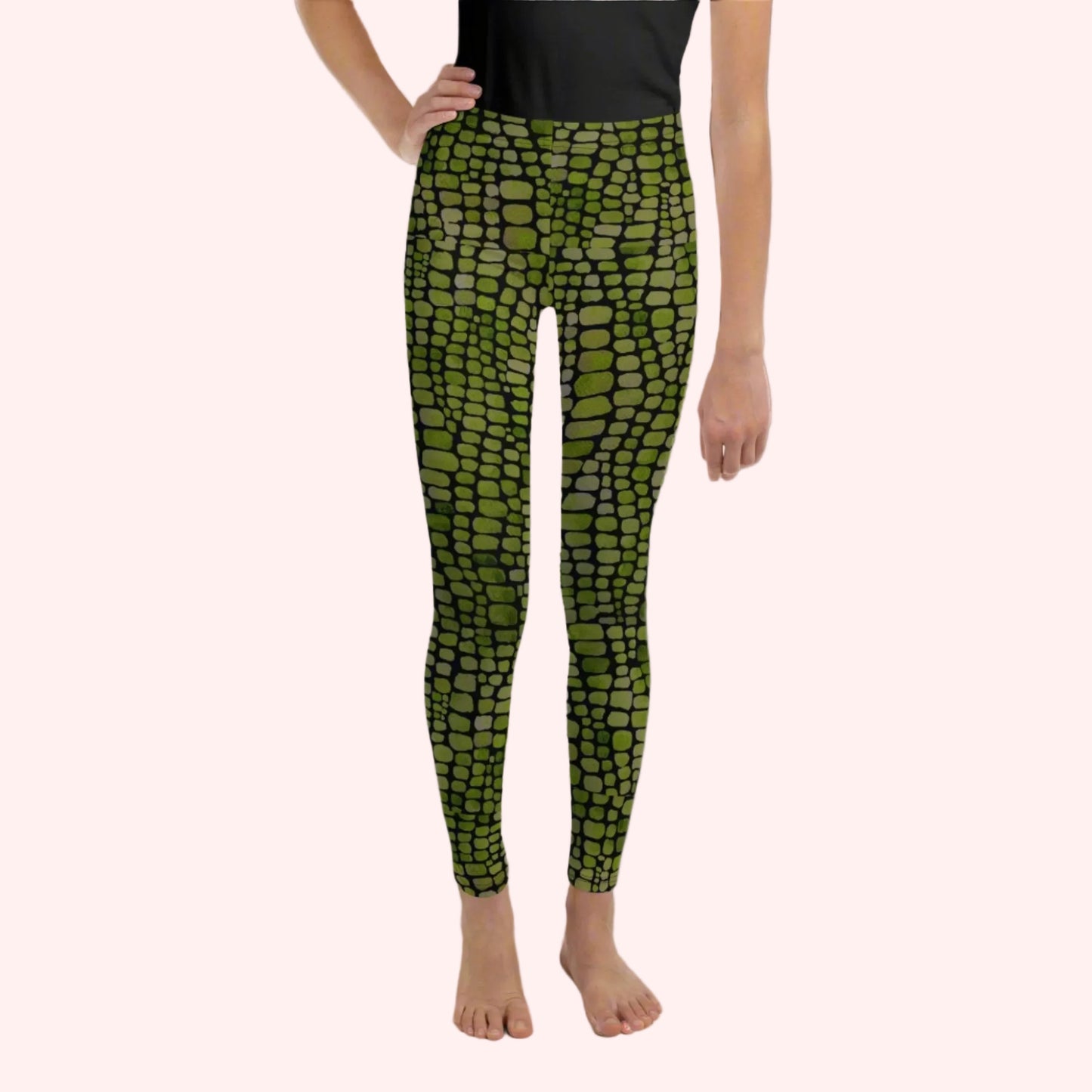 Reptile print youth girls leggings, size 8-20. These green yoga pants have a black reptile print pattern. These tights are available in plus/ extended sizes, and are perfect for casual wear, cosplay, Halloween Trick or treating or yoga class. Similar to a snake, lizard or dinosaur print, by jaecrece