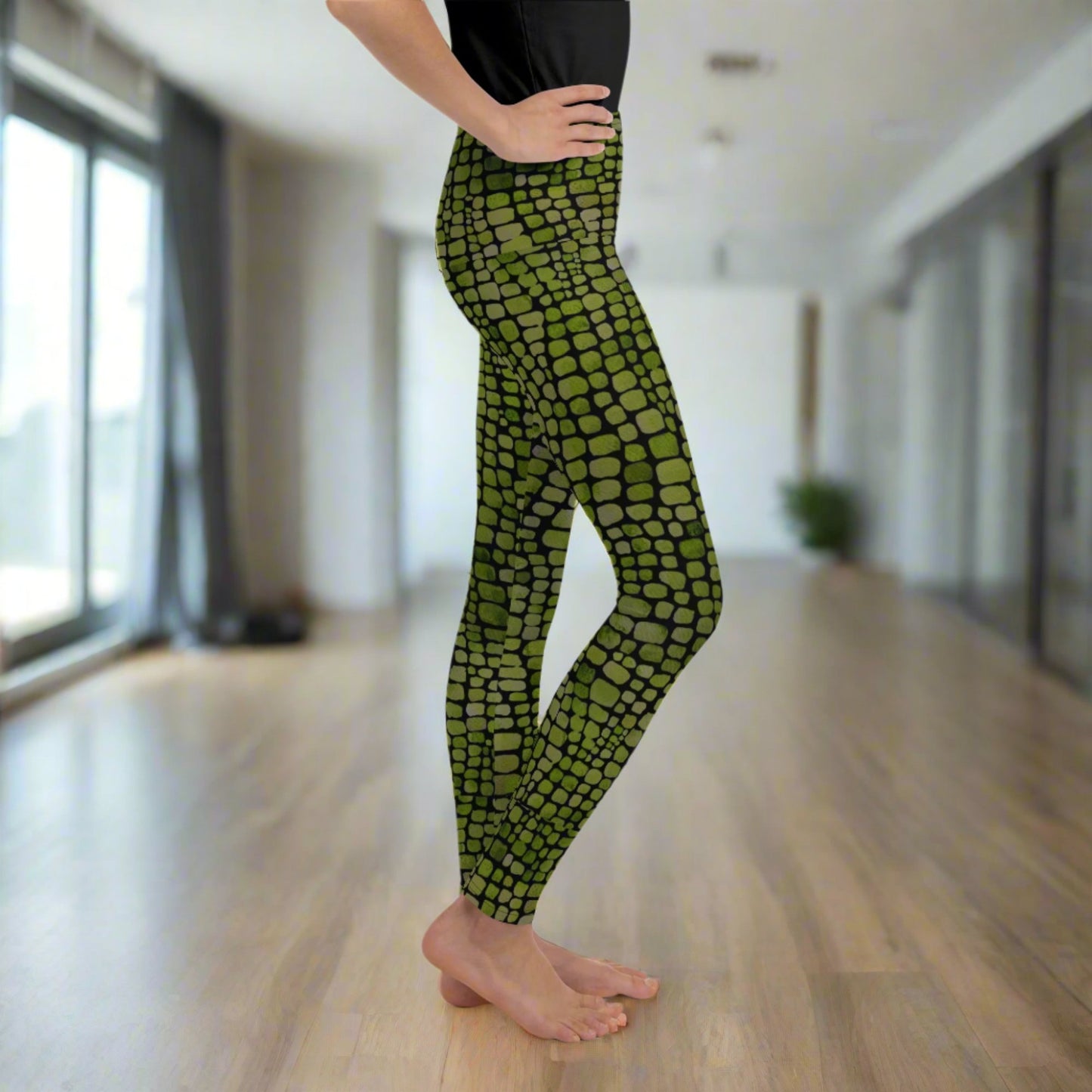 Reptile print youth girls leggings, size 8-20. These green yoga pants have a black reptile print pattern. These tights are available in plus/ extended sizes, and are perfect for casual wear, cosplay, Halloween Trick or treating or yoga class. Similar to a snake, lizard or dinosaur print, by jaecrece