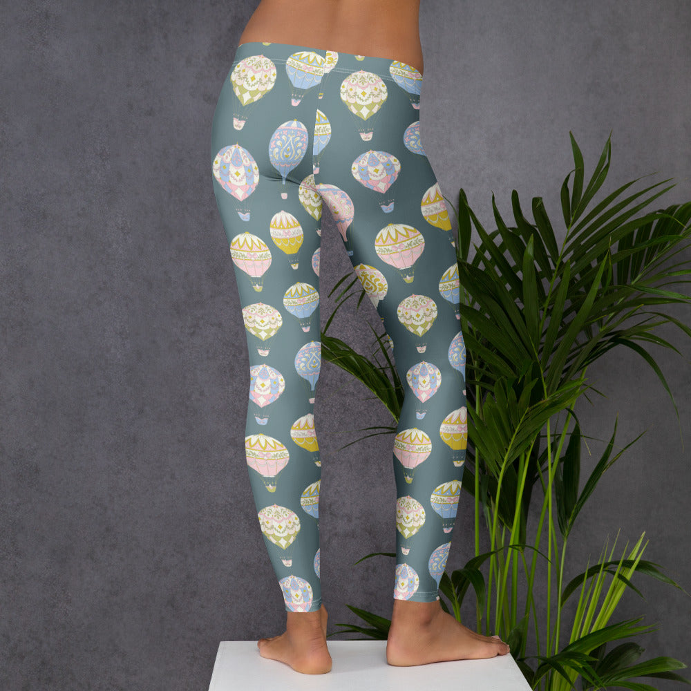 Hot Air Balloon Pattern Leggings for women featuring a slate blue backdrop and whimsical pastel balloons. These mid-rise, full-length yoga leggings are made from stretchy, durable microfiber yarn that keeps its shape. Perfect for moms who love family matching outfits, travel aesthetics, and lightweight activewear with four-way stretch comfort.