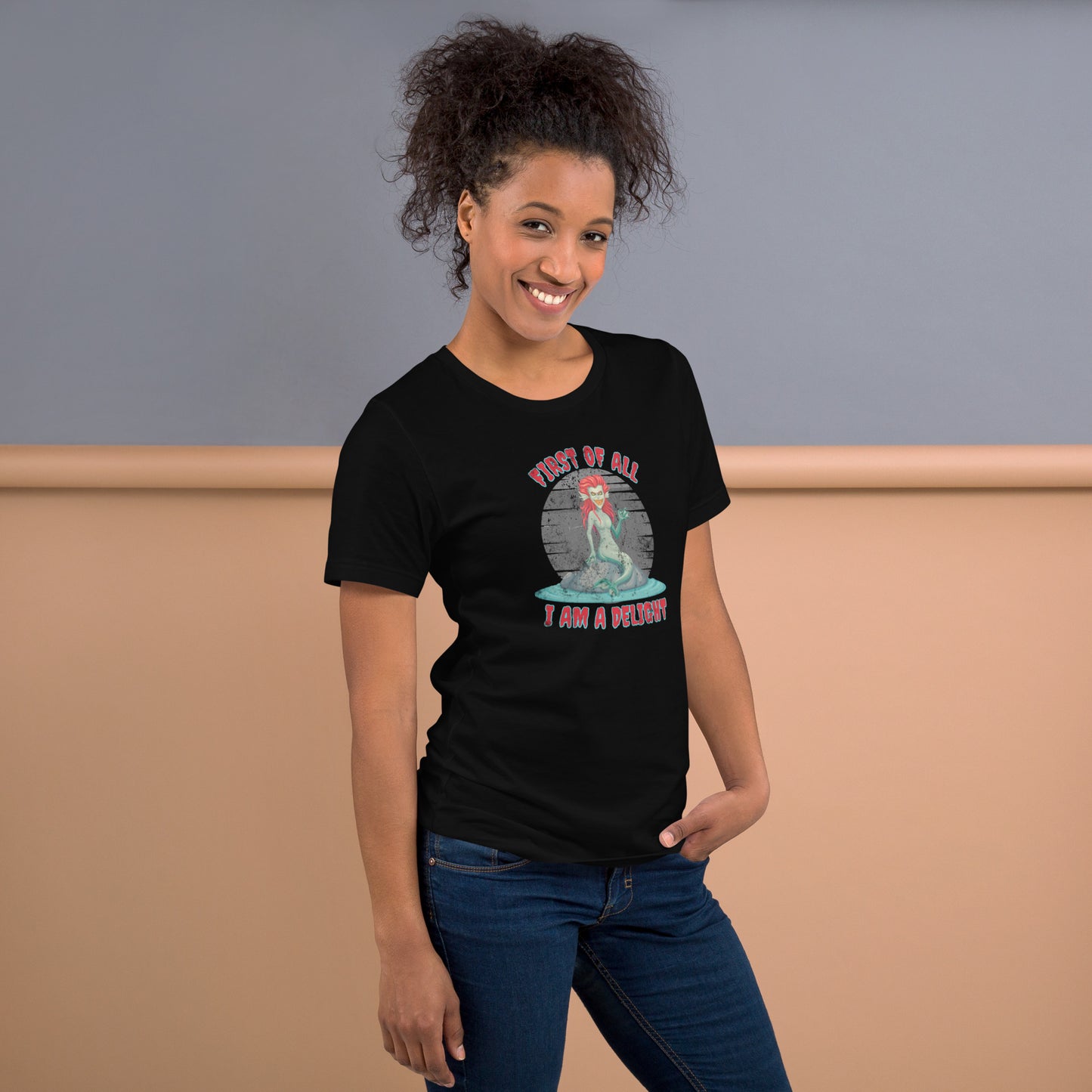 Dark fantasy siren t-shirt with sarcastic quote “First of All I Am a Delight,” featuring a gothic mermaid on a rock in the ocean. Great for Halloween parties, Ren Faire costumes, or mythology-inspired casual wear. Printed on Bella Canvas 3001 unisex shirt in black, Heather Midnight Navy, or Heather Grey, XS–5XL. A snarky gothic mermaid graphic tee for sea creature lovers, sarcastic gift ideas, and spooky season fashion with mythical creature flair.