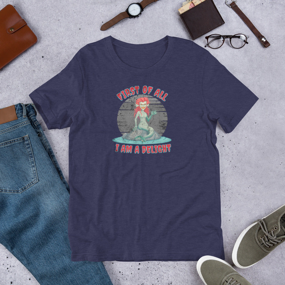 Evil siren graphic tee with snarky quote “First of All I Am a Delight,” blending gothic humor and mythology. Perfect for Halloween events, cosplay, or Renaissance fairs. Printed on Bella Canvas 3001 unisex t-shirt in sizes XS–5XL, available in black, Heather Midnight Navy, or Heather Grey. This sarcastic mermaid shirt is a fun gift for gothic fashion lovers, spooky sea creature fans, or mythology enthusiasts who enjoy witty fantasy apparel.