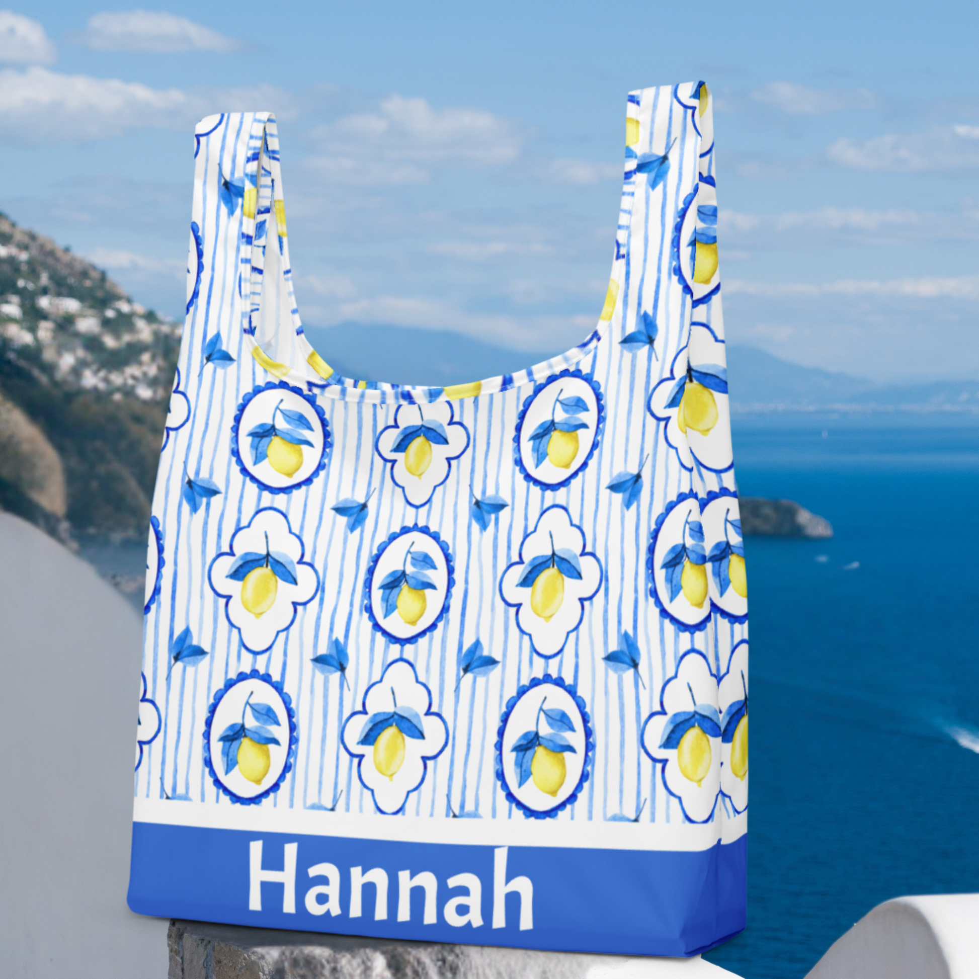 Brighten any summer with this eco friendly Amalfi Coast tote bag featuring a playful lemon print. A stylish Italian summer tote, this reusable shopping tote folds up small with an elastic band for on the go convenience. Perfect for beach lovers, teens on cruises, or as a casual Italy vacation bag. Ideal for travel, farmers markets, or daily errands, this Italian lemon tote captures La Dolce Vita style while making a thoughtful gift.