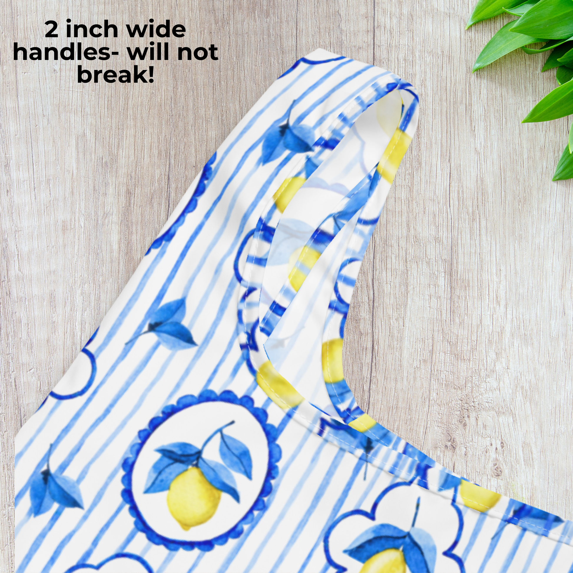 Reusable Amalfi Lemon Tote Bag with Italian summer style, featuring vibrant lemons, coastal tile details, and washable eco friendly polyester. Perfect as a travel tote, grocery bag, or beach carryall, this lightweight yet durable bag folds small with its elastic band. Measuring 15.5" × 25.3", it offers plenty of space for daily essentials while staying compact when stored. Great gift for women, moms, and travel lovers.