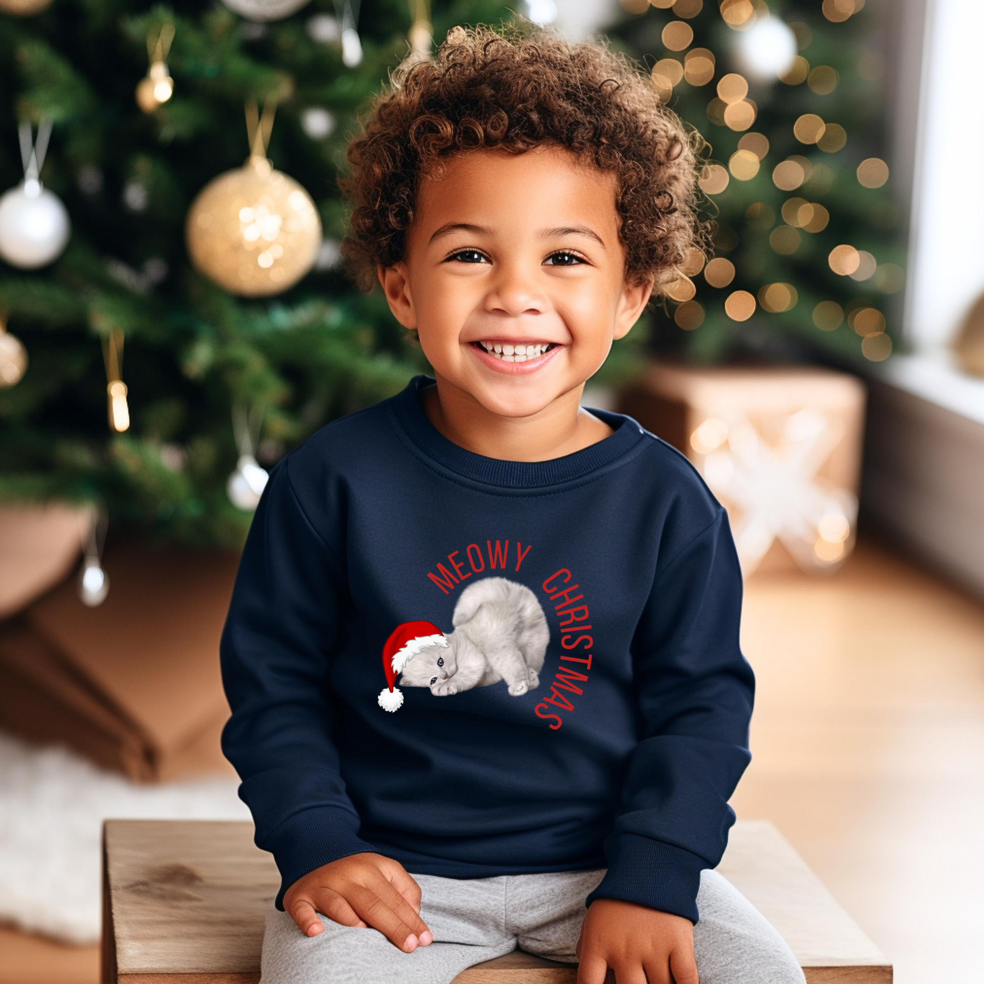 Get festive with this Youth Meowy Christmas Sweatshirt in XS–XL, a cozy addition to our matching family Christmas collection. Featuring a cute holiday cat, this pullover is ideal for kids and tweens who love animals and seasonal fun. Whether you’re headed to a holiday parade, taking Christmas photos, or sipping cocoa by the fire, this unisex sweatshirt helps the whole family match in comfort and style.
