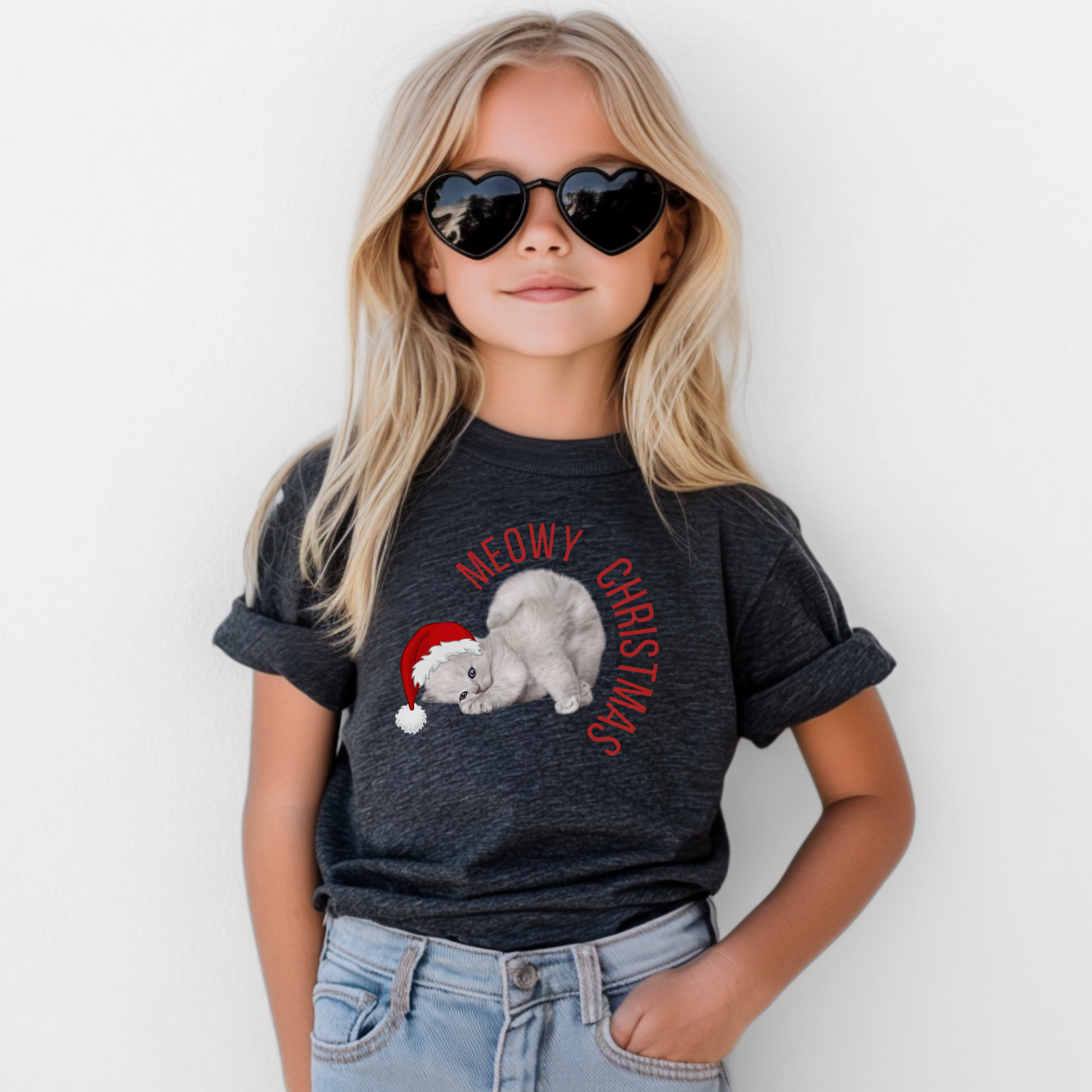 Adorable Meowy Christmas youth shirt with a gray kitten in a Santa hat and bright blue eyes. Designed for cat-loving kids, this holiday shirt is soft, unisex, and perfect for family matching outfits. Great for Christmas Eve pajamas, school parties, or festive winter fun. A top choice for kids’ Christmas clothing, sibling photos, and anyone looking for a cute, funny, and cozy Christmas cat tee.