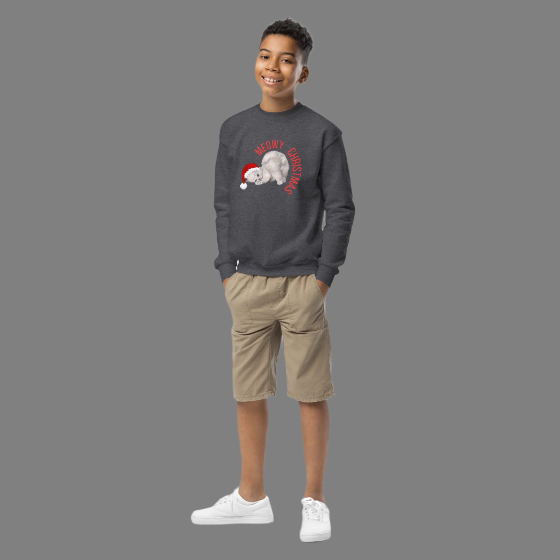 Add some holiday humor to your child's wardrobe with this Youth Meowy Christmas Sweatshirt in sizes XS to XL. The playful Christmas cat design is perfect for kids who love animals, puns, and seasonal fun. Whether they’re headed to school holiday events or enjoying cozy moments at home, this soft pullover brings comfort and festive flair. A great gift for cat-loving tweens during the holidays.