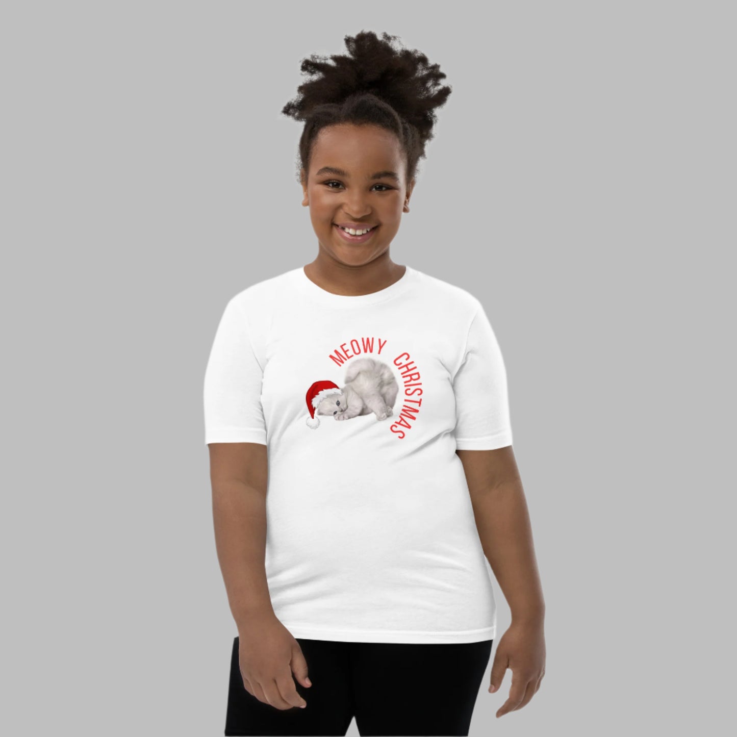 Celebrate the season with this Meowy Christmas youth unisex shirt! Featuring an adorable gray kitten with blue eyes and a Santa hat, this holiday t-shirt is perfect for Christmas-loving kids. Ideal for family matching holiday outfits, festive school days, or cozy Christmas Eve fun. Comes in sizes S–XL for boys and girls. A funny cat-themed tee that makes a great Christmas gift for cat lovers and kids alike.