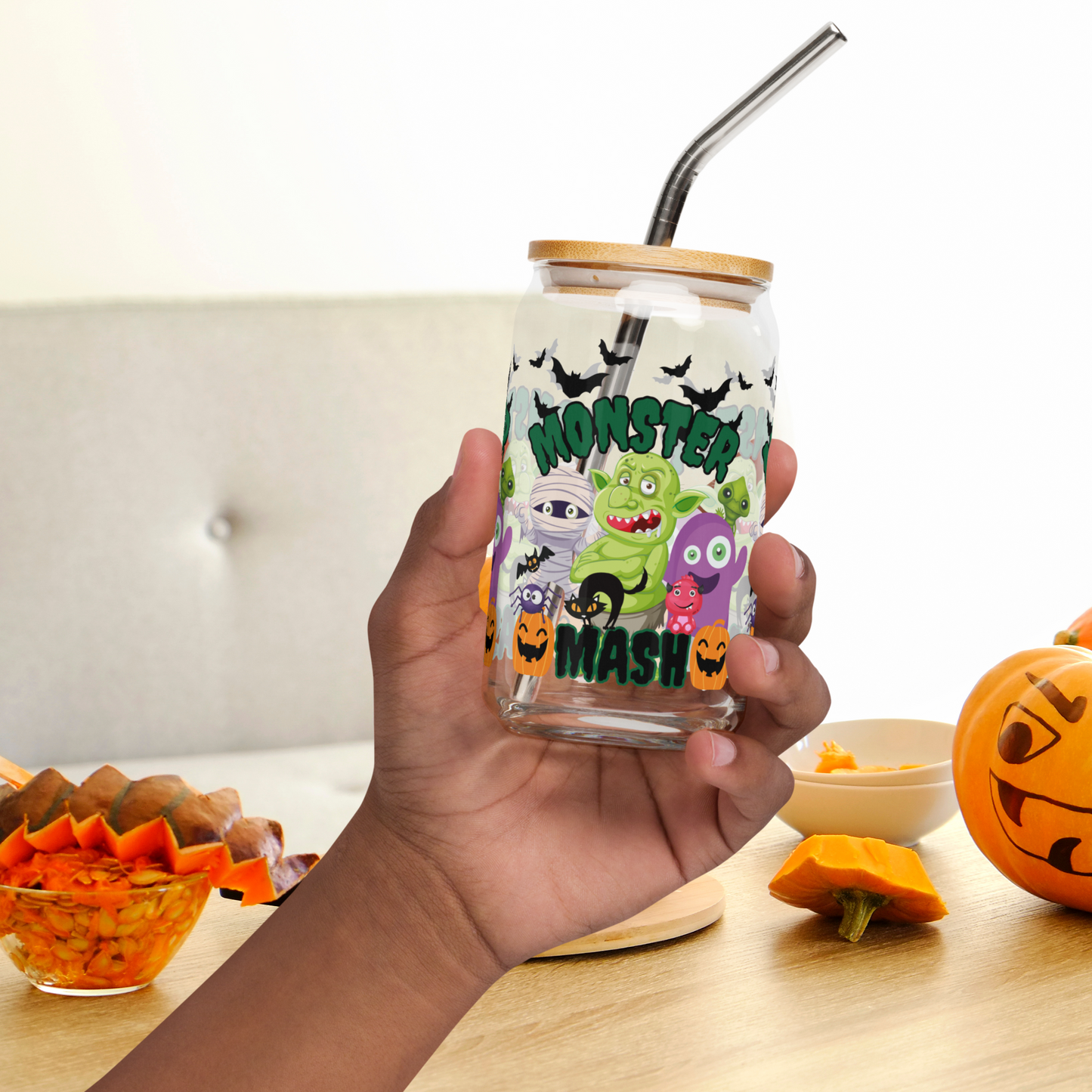 Monster Mash Halloween glass can, 16 oz sipper with bamboo lid and straw, decorated with adorable monster characters, bats, and pumpkins. Perfect reusable iced coffee cup, cocktail tumbler, or sparkling water glass for spooky season. Durable eco-friendly drinkware for Halloween parties, fall entertaining, or everyday use. Makes a thoughtful seasonal gift for friends, teachers, or family. Trendy reusable glass can for autumn beverages.