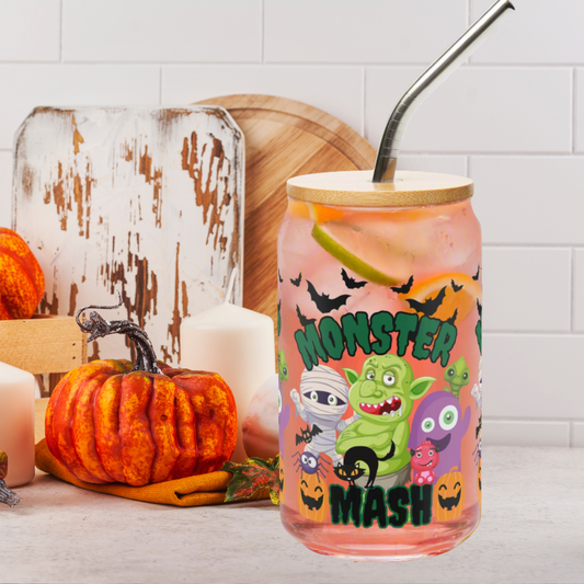 Monster Mash Halloween glass can, 16 oz sipper with bamboo lid and straw, decorated with adorable monster characters, bats, and pumpkins. Perfect reusable iced coffee cup, cocktail tumbler, or sparkling water glass for spooky season. Durable eco-friendly drinkware for Halloween parties, fall entertaining, or everyday use. Makes a thoughtful seasonal gift for friends, teachers, or family. Trendy reusable glass can for autumn beverages.