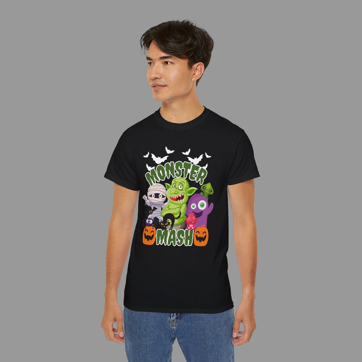 Monster Mash Adult Unisex Halloween Shirt, featuring a mash up of lots of cute Halloween family friendly cartoon monsters, including a mummy, spider, black cat, 2 friendly pumpkins, a troll and lots of bats, by jaecrece.com