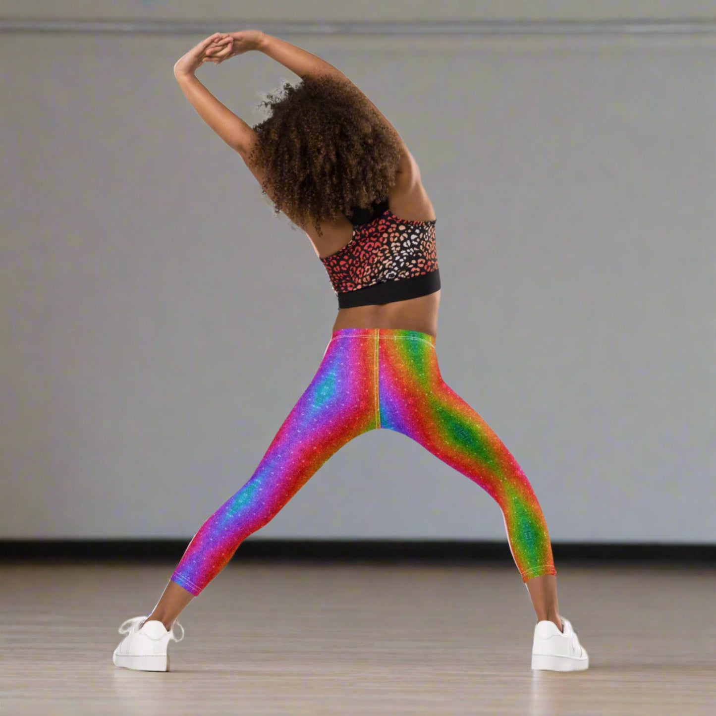 Rainbow swirl leggings for girls sizes 2T–7 with a holographic faux glitter look. Designed for toddlers and little girls who love bold colors, these stretchy leggings are comfy, stylish, and perfect for matching with older siblings or mom at Pride, Mardi Gras, or family fun days. A joyful wardrobe essential for colorful kids.