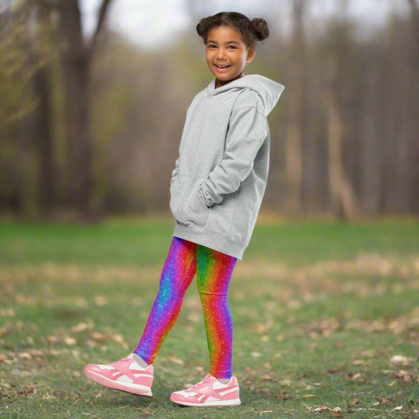 Girls’ rainbow swirl leggings in toddler and youth sizes (2T–7) featuring a faux glitter design. These holographic print leggings are soft, stretchy, and perfect for dancing, running, or celebrating Pride and Mardi Gras. Great for family matching outfits and bold toddler fashion moments. A fun and colorful addition to any active girl's wardrobe.