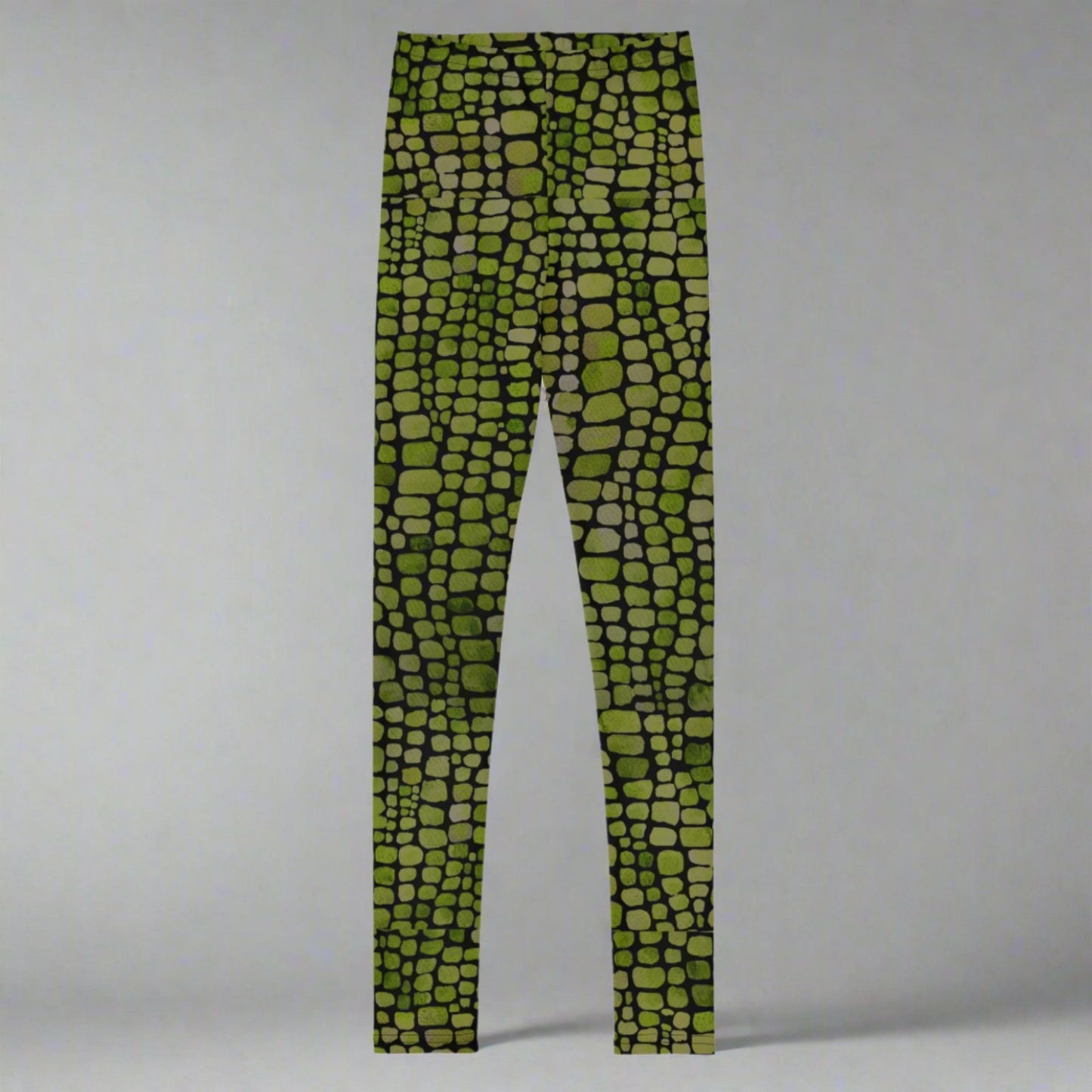 Reptile print youth girls leggings, size 8-20. These green yoga pants have a black reptile print pattern. These tights are available in plus/ extended sizes, and are perfect for casual wear, cosplay, Halloween Trick or treating or yoga class. Similar to a snake, lizard or dinosaur print, by jaecrece