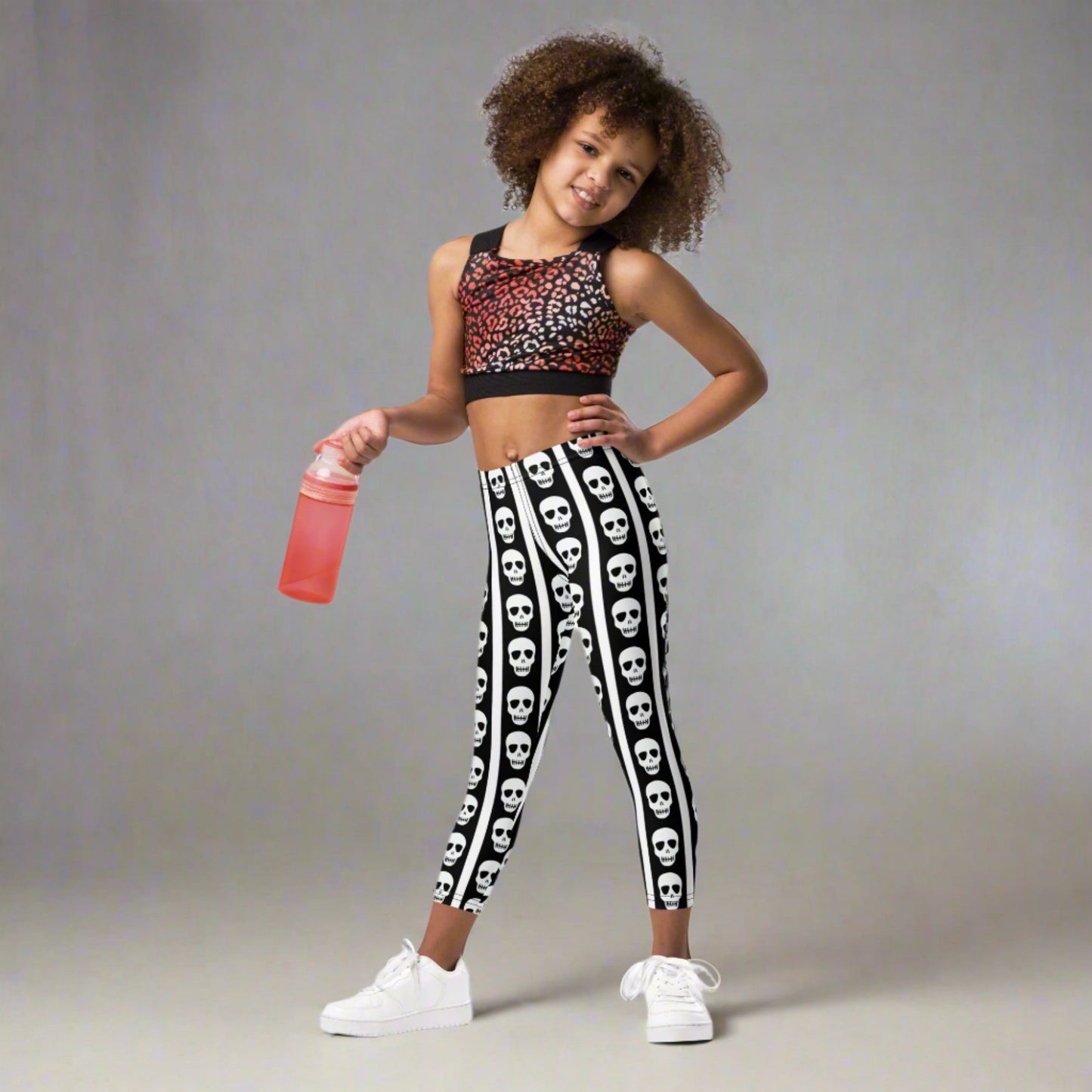Image: For spooky season or year-round fun, these kids leggings feature vertical stripes in black and white with skulls lined up on each leg. Designed with comfort and play in mind, these soft leggings are ideal for imaginative dress-up or casual outings. Offered in toddler and youth sizes, they bring playful edge to every outfit for your tiny trendsetter, by jaecrece.