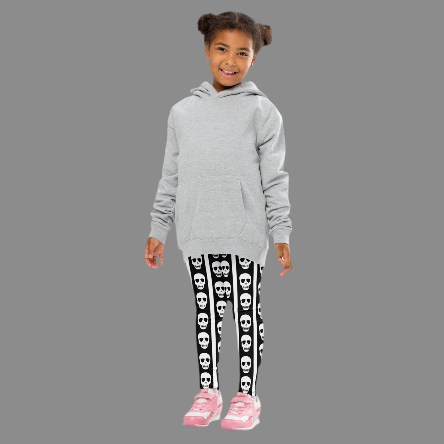 Image: Perfect for the little one with big personality, these striped skull leggings bring a cool and creepy twist to everyday wear. Featuring black and white vertical stripes with a line of skulls on each leg, they’re ideal for Halloween costumes or spooky playdates. Soft and stretchy for all-day movement, they come in toddler and child sizes to fit every mini mischief maker, by jaecrece.