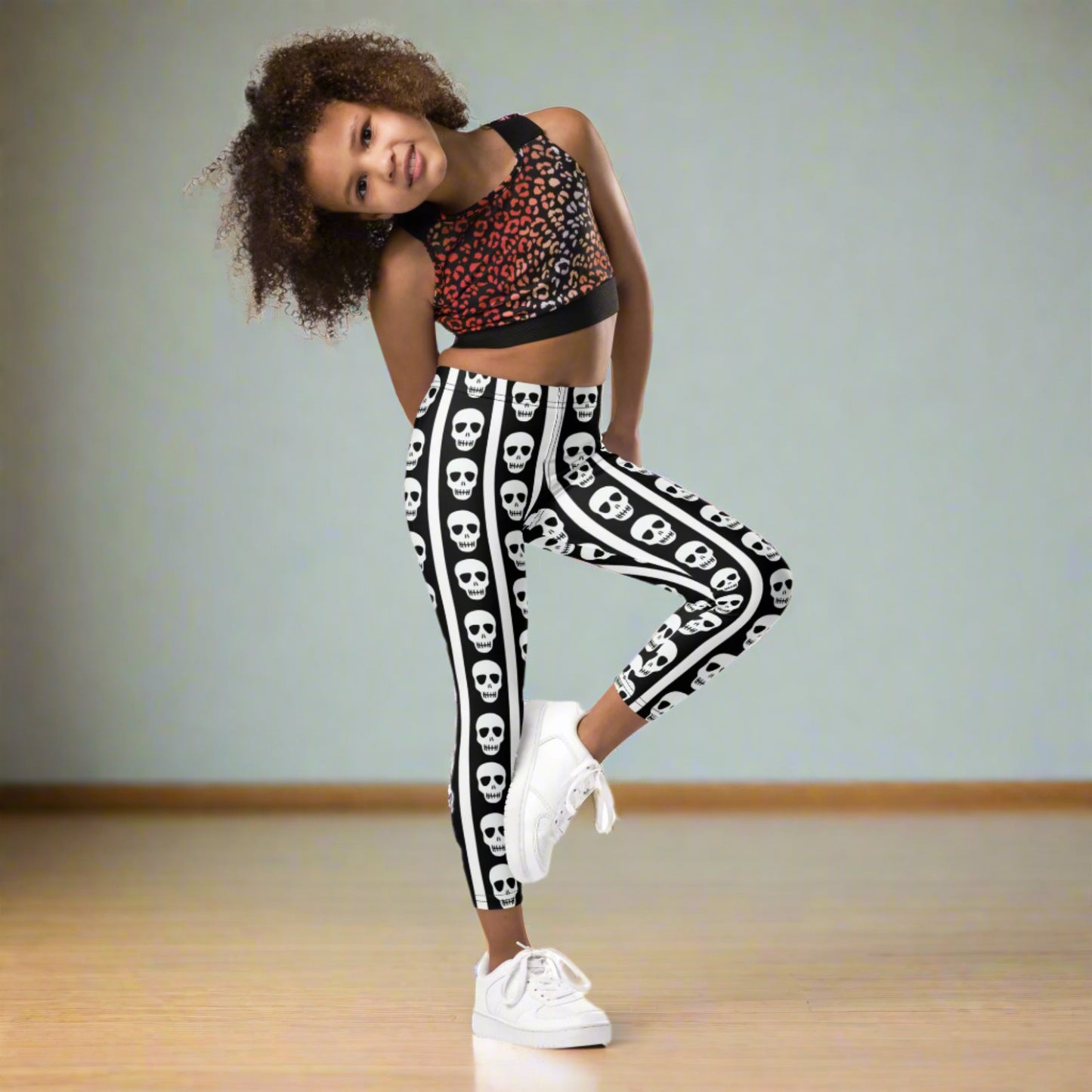 Image: For spooky season or year-round fun, these kids leggings feature vertical stripes in black and white with skulls lined up on each leg. Designed with comfort and play in mind, these soft leggings are ideal for imaginative dress-up or casual outings. Offered in toddler and youth sizes, they bring playful edge to every outfit for your tiny trendsetter, by jaecrece.