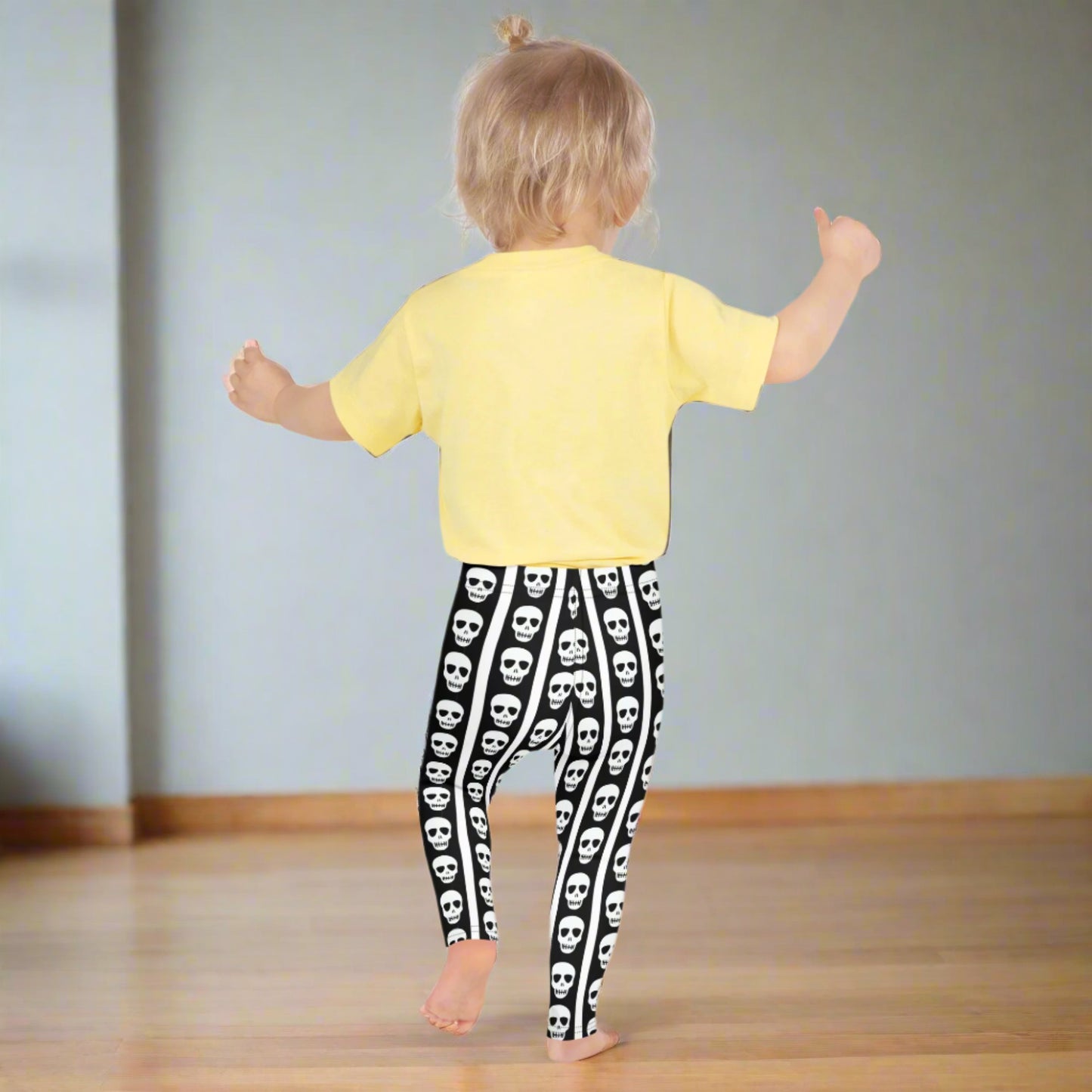 Image: These striped skull leggings for toddlers and kids offer spooky style in a comfy package. The bold black and white stripes give circus vibes while skull details add a fun Halloween touch. Whether paired with a tee or layered under a costume, they’re perfect for themed playdates or festive family photos. Available in multiple child and toddler sizes, by jaecrece.