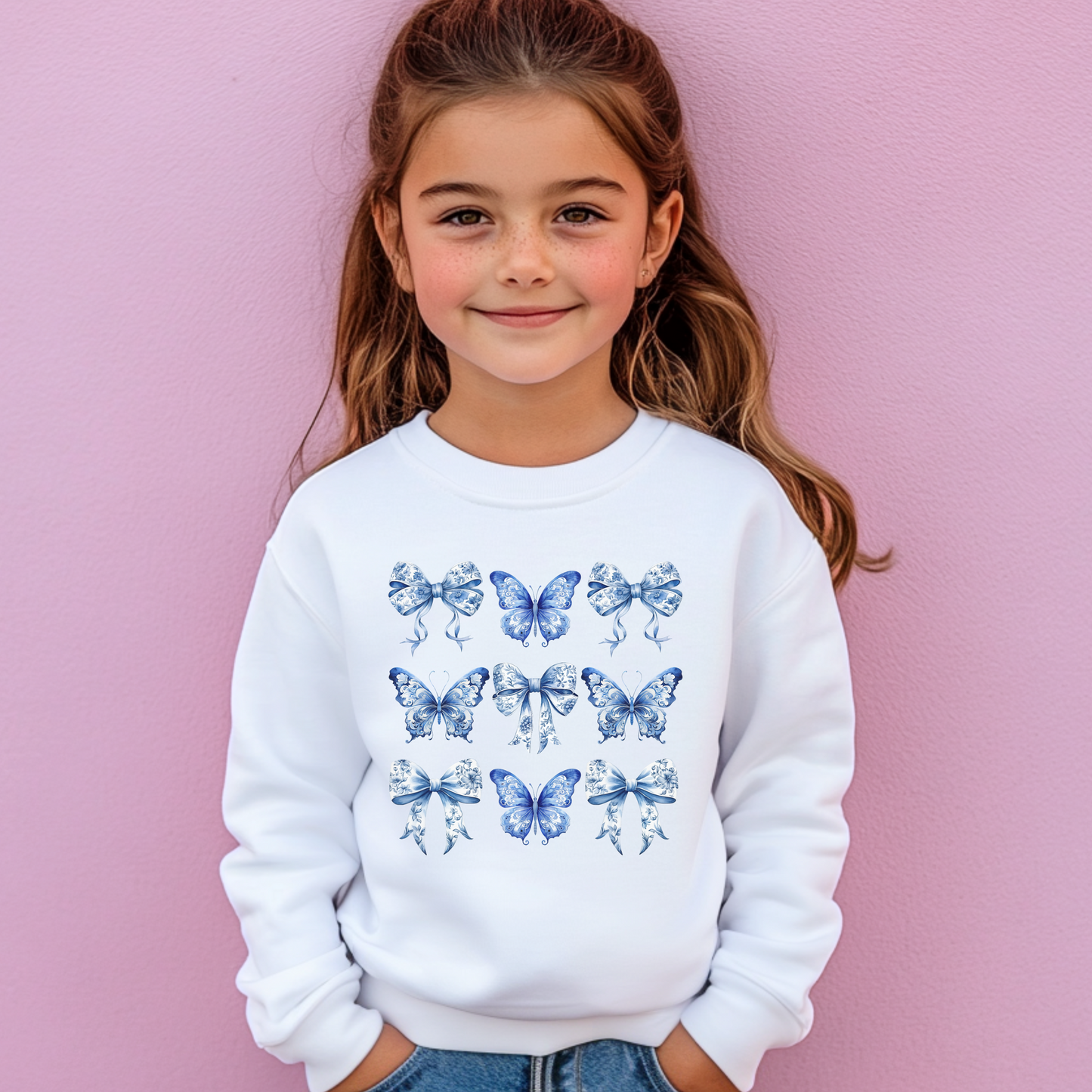 Blue Toile Girls Sweatshirt in Navy and White featuring delicate butterflies and bows in a classic toile pattern. This cozy top is perfect for girls and tweens in sizes XS–XL, embracing soft girl aesthetic, Texas coquette, coastal cowgirl, and whimsical cottagecore styles. Ideal for layering in spring or fall, casual outfits, or family gatherings, this sweatshirt is part of a matching family collection, perfect for sibling coordination, mom and daughter photos, or as a thoughtful birthday gift for girls who