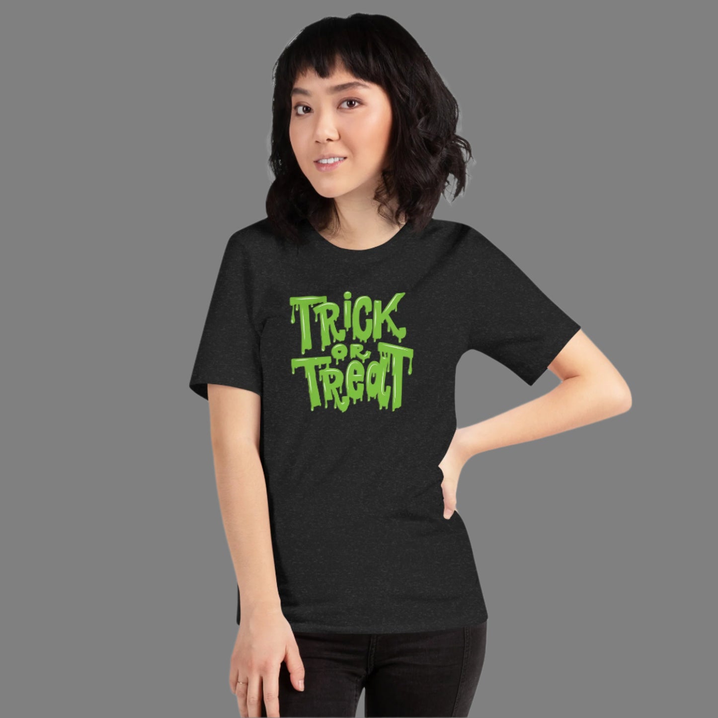 Soft unisex Halloween shirt with Trick or Treat printed in oozing green slime. A perfect mix of humor and horror, this Halloween tee adds bold style to your spooky season. Whether you’re handing out candy or attending a haunted event, this shirt is comfy, festive, and available in inclusive sizes XS through 5XL.