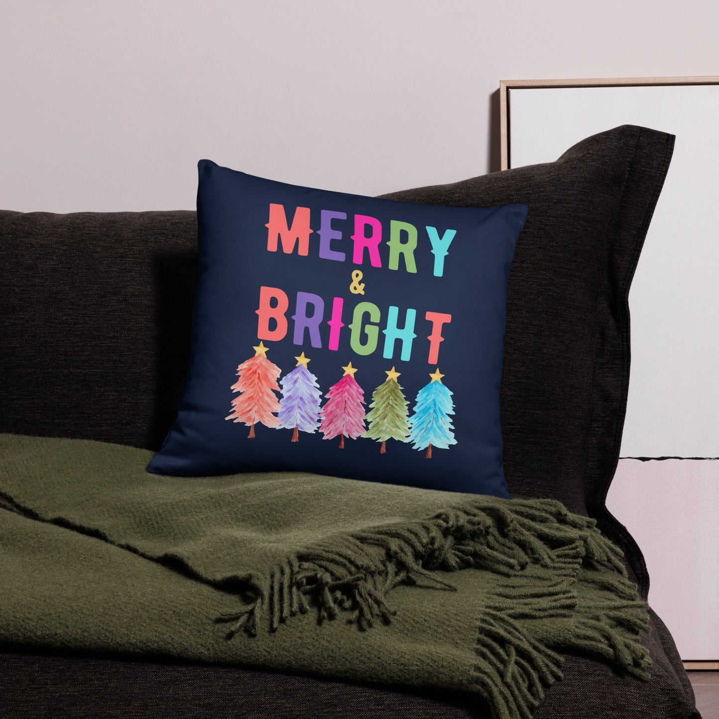Merry & Bright Christmas Throw Pillow, Holiday Home and Patio Decor. This square pillow has a deep blue navy background, with Merry & Bright printed in Coral, Purple, Pink, Green, Teal. This pillow also features Christmas trees in the same colors. by jaecrece