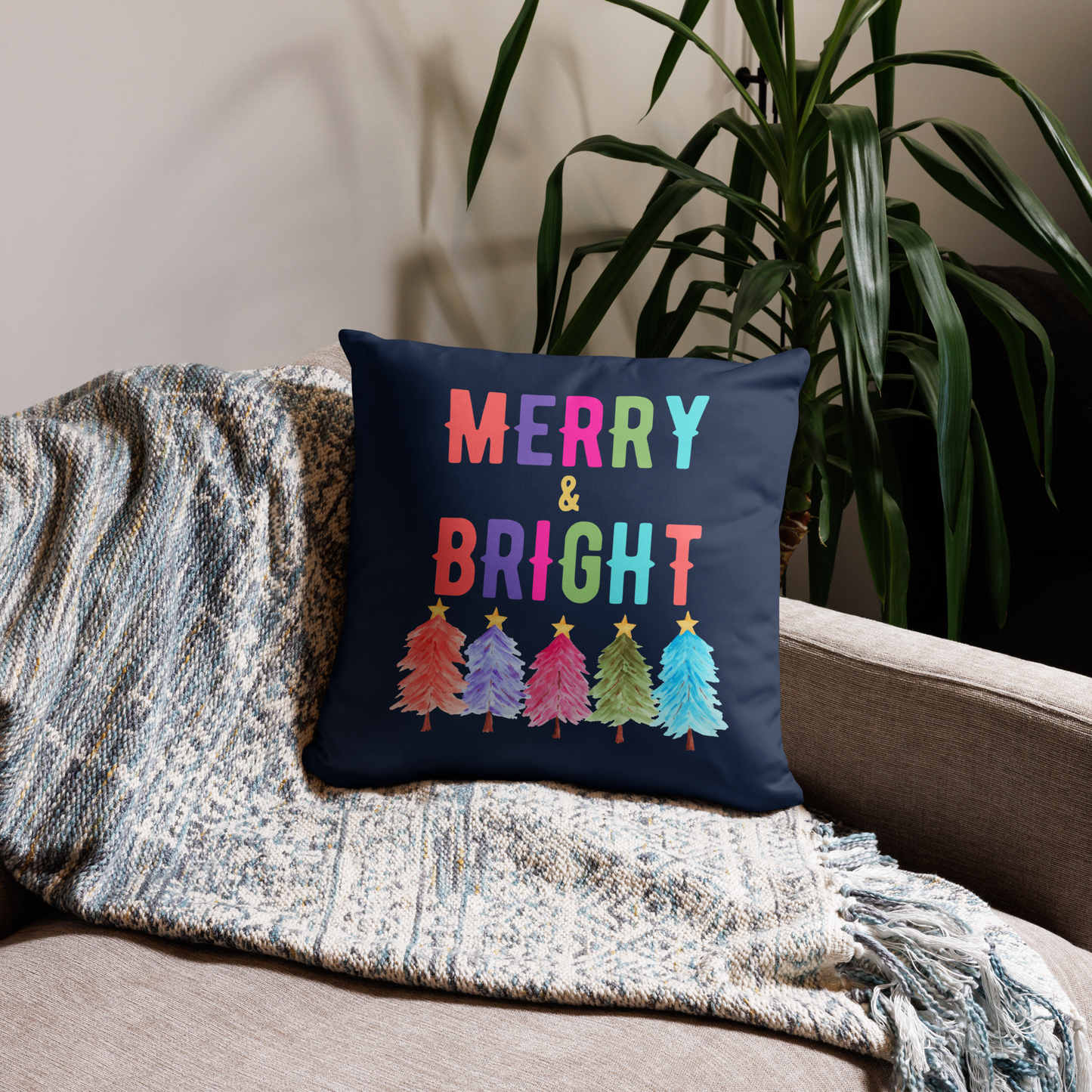 Merry & Bright Christmas Throw Pillow, Holiday Home and Patio Decor. This square pillow has a deep blue navy background, with Merry & Bright printed in Coral, Purple, Pink, Green, Teal. This pillow also features Christmas trees in the same colors. by jaecrece