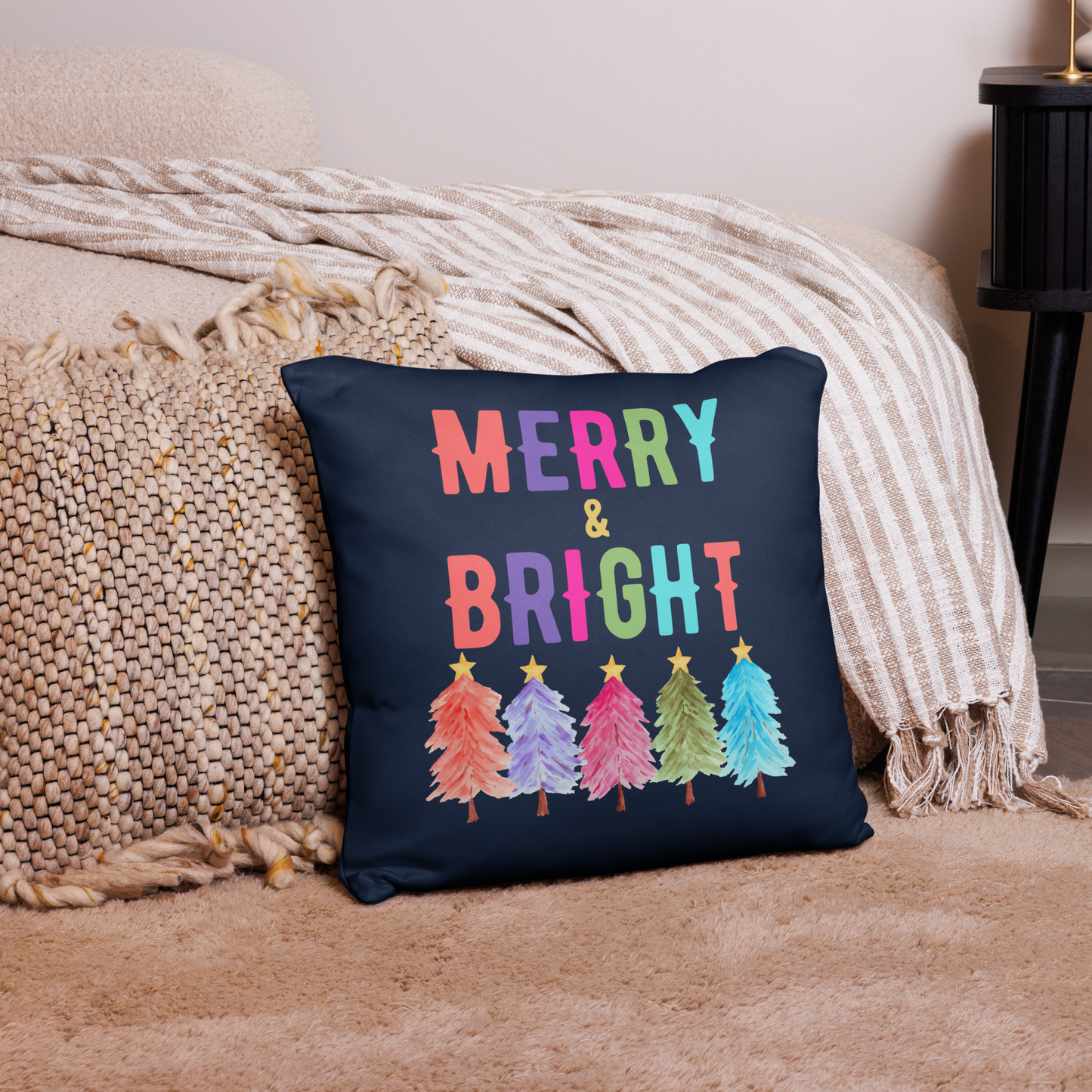 Merry & Bright Christmas Throw Pillow, Holiday Home and Patio Decor. This square pillow has a deep blue navy background, with Merry & Bright printed in Coral, Purple, Pink, Green, Teal. This pillow also features Christmas trees in the same colors. by jaecrece