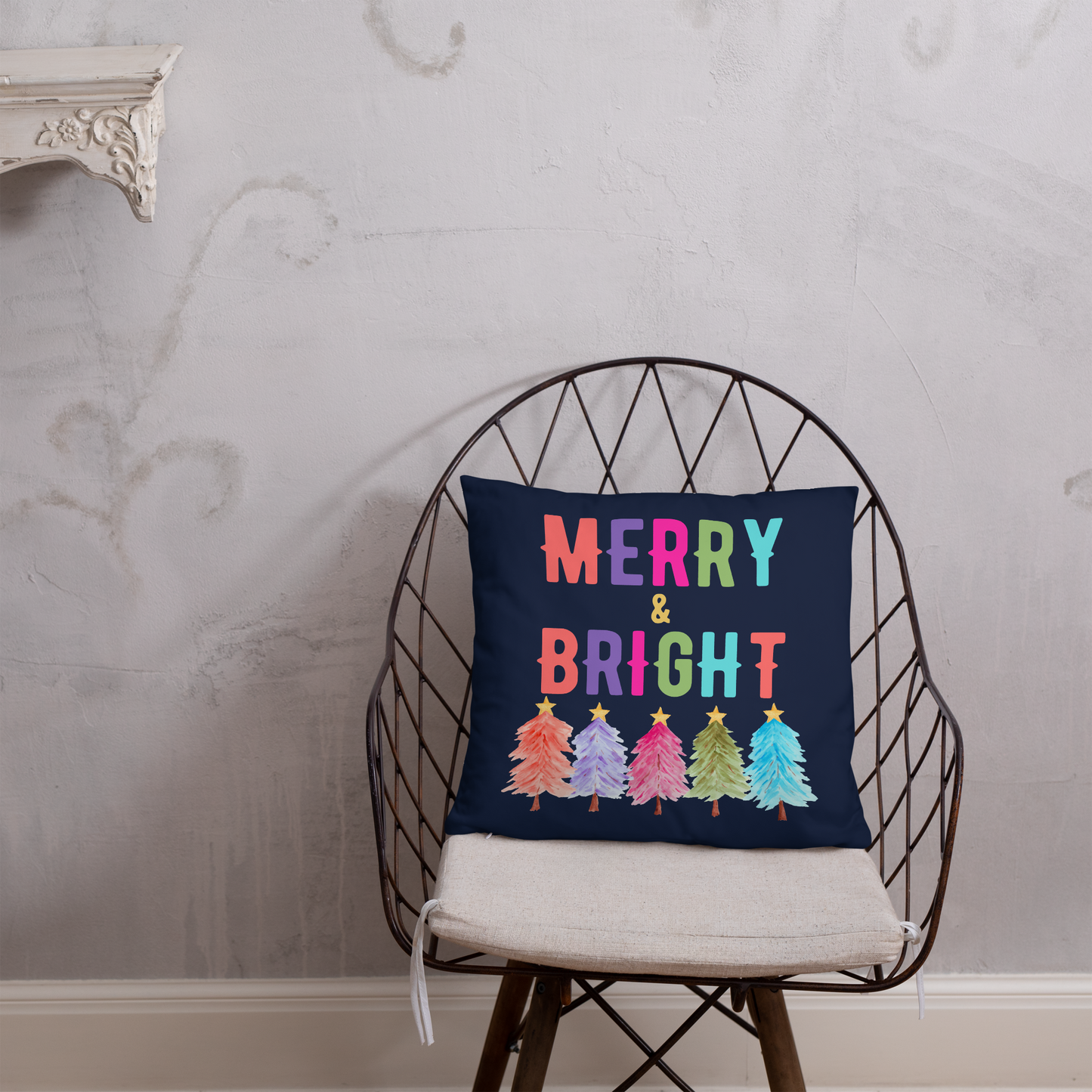 Merry & Bright Christmas Throw Pillow, Holiday Home and Patio Decor. This square pillow has a deep blue navy background, with Merry & Bright printed in Coral, Purple, Pink, Green, Teal. This pillow also features Christmas trees in the same colors. by jaecrece