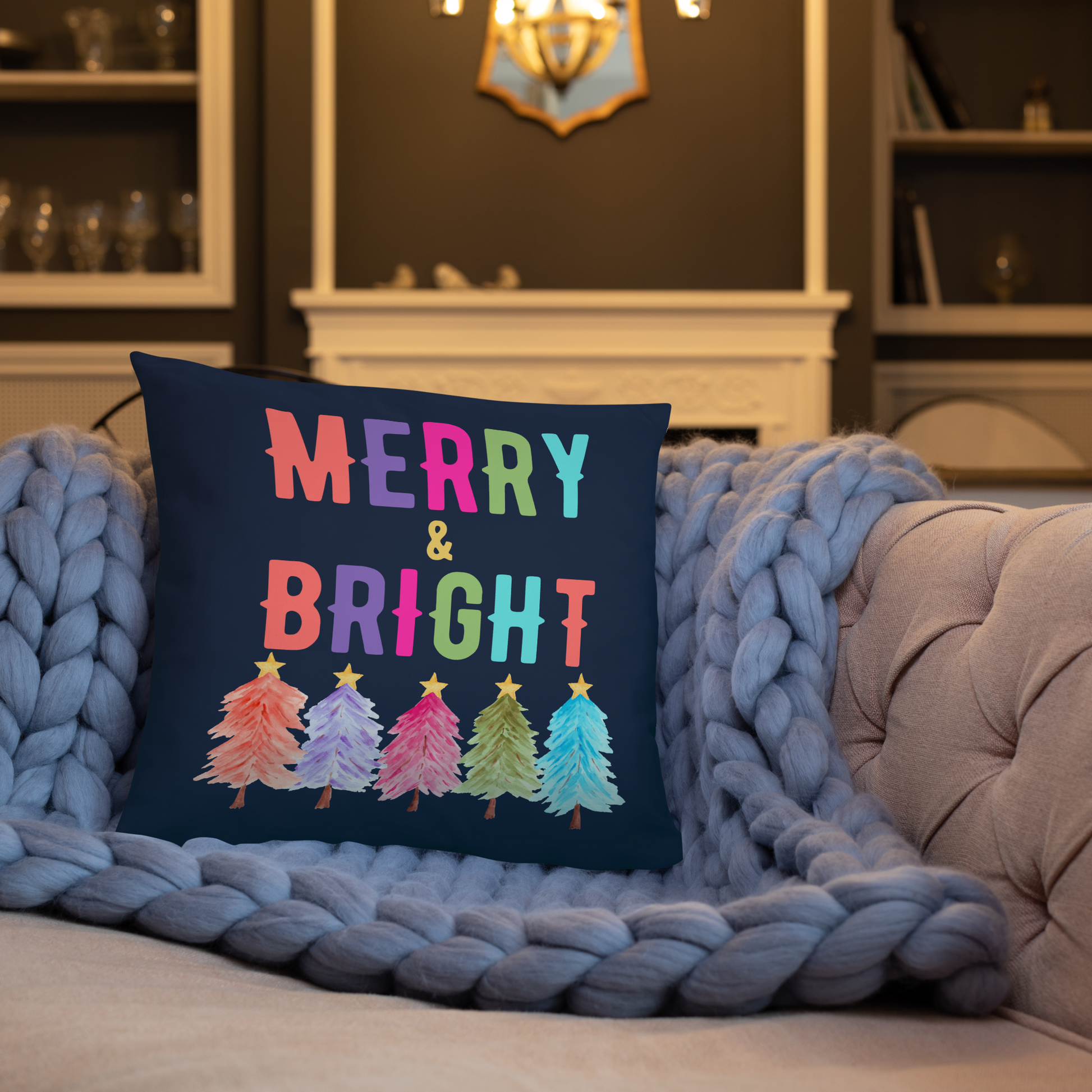 Merry & Bright Christmas Throw Pillow, Holiday Home and Patio Decor. This square pillow has a deep blue navy background, with Merry & Bright printed in Coral, Purple, Pink, Green, Teal. This pillow also features Christmas trees in the same colors. by jaecrece