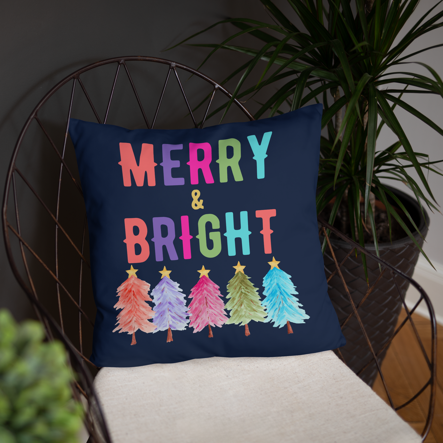 Merry & Bright Christmas Throw Pillow, Holiday Home and Patio Decor. This square pillow has a deep blue navy background, with Merry & Bright printed in Coral, Purple, Pink, Green, Teal. This pillow also features Christmas trees in the same colors. by jaecrece