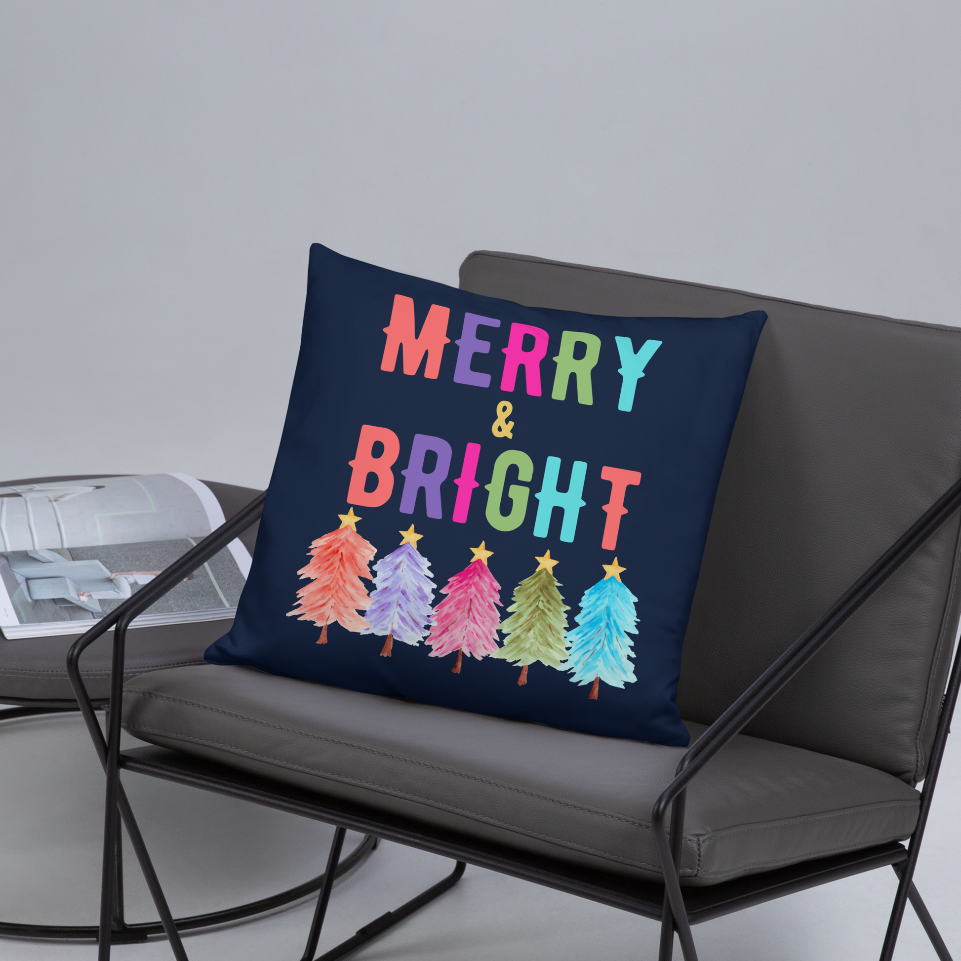 Merry & Bright Christmas Throw Pillow, Holiday Home and Patio Decor. This square pillow has a deep blue navy background, with Merry & Bright printed in Coral, Purple, Pink, Green, Teal. This pillow also features Christmas trees in the same colors. by jaecrece